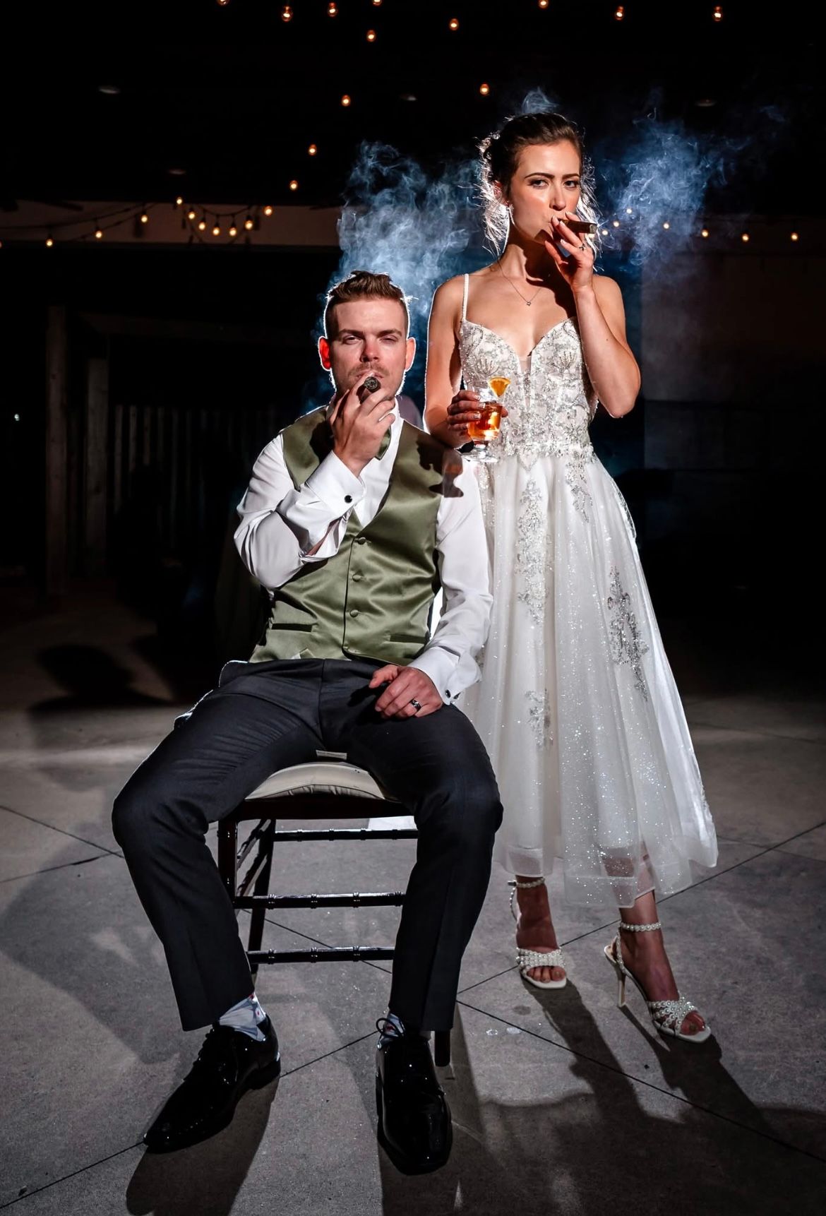 Dramatic black and white wedding photo series with smoke effects and moody lighting.