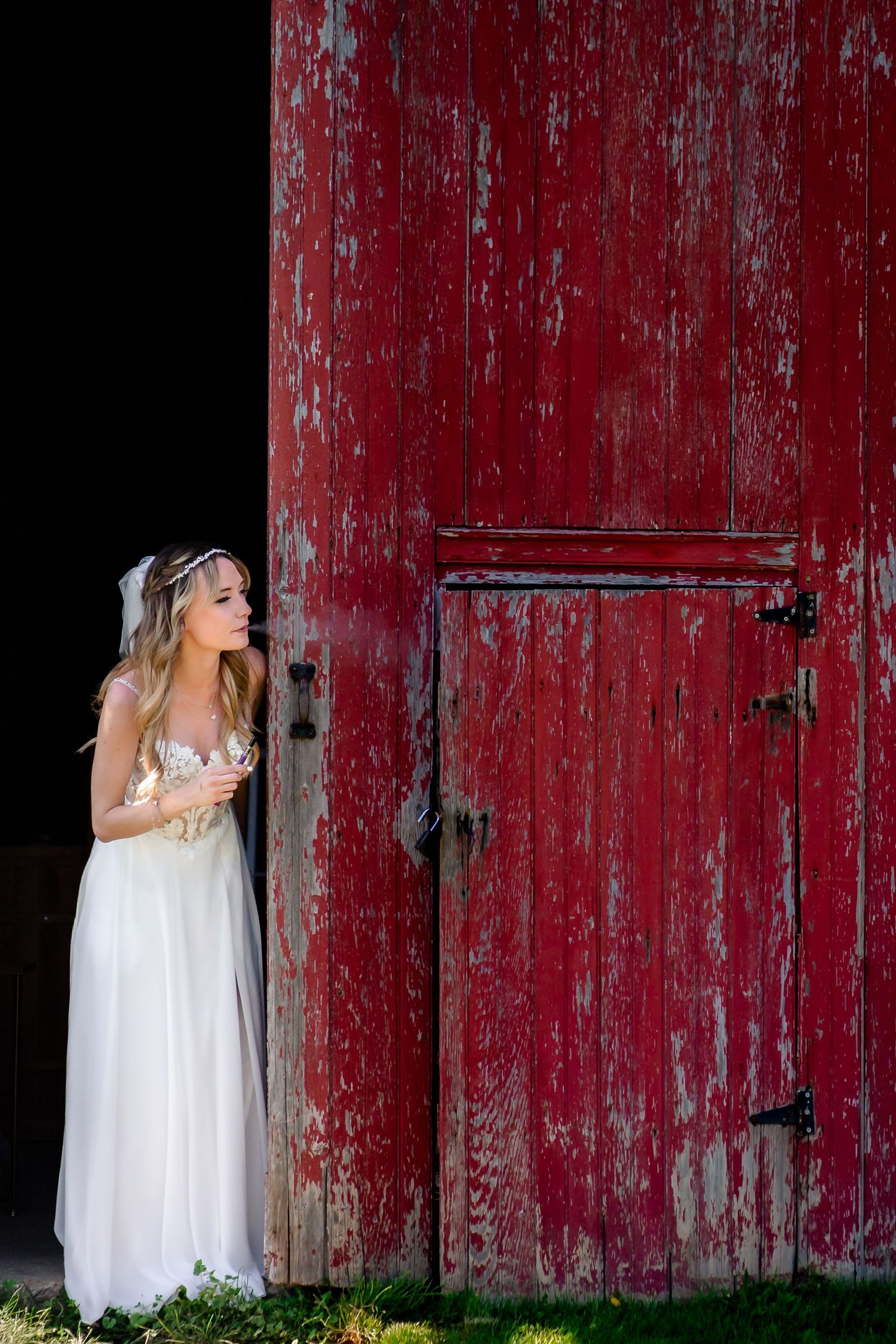 Artistic bridal portraits against weathered red barn wood.
