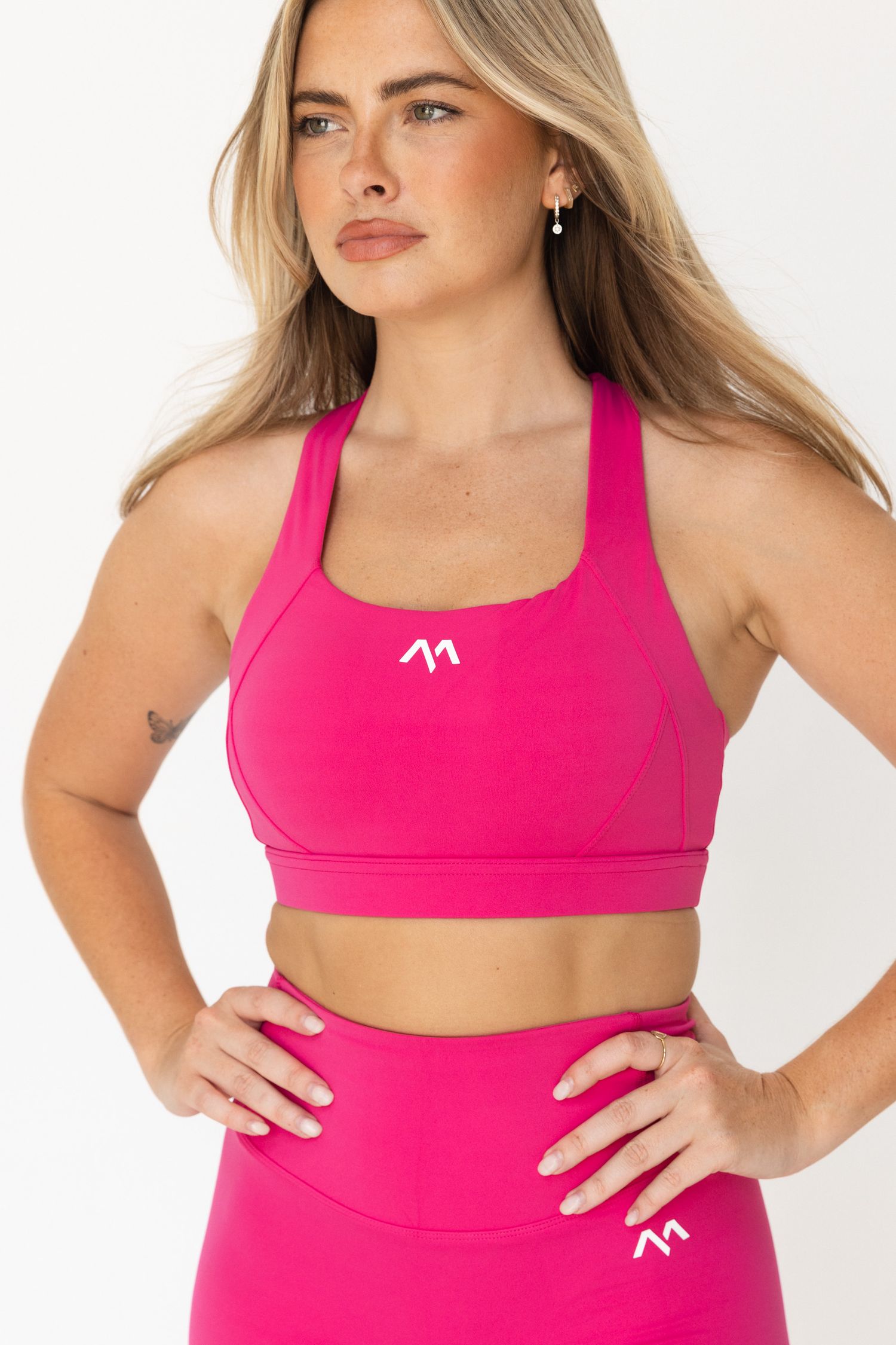 Hot pink athletic wear set shown from multiple angles on white background.