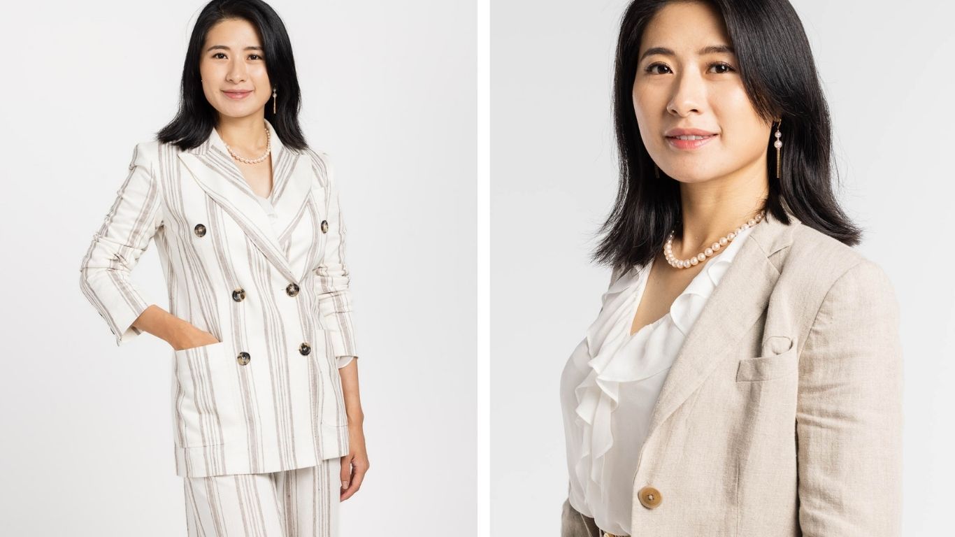Model wearing a white linen button-down shirt with short sleeves and a collar in a professional studio setting.