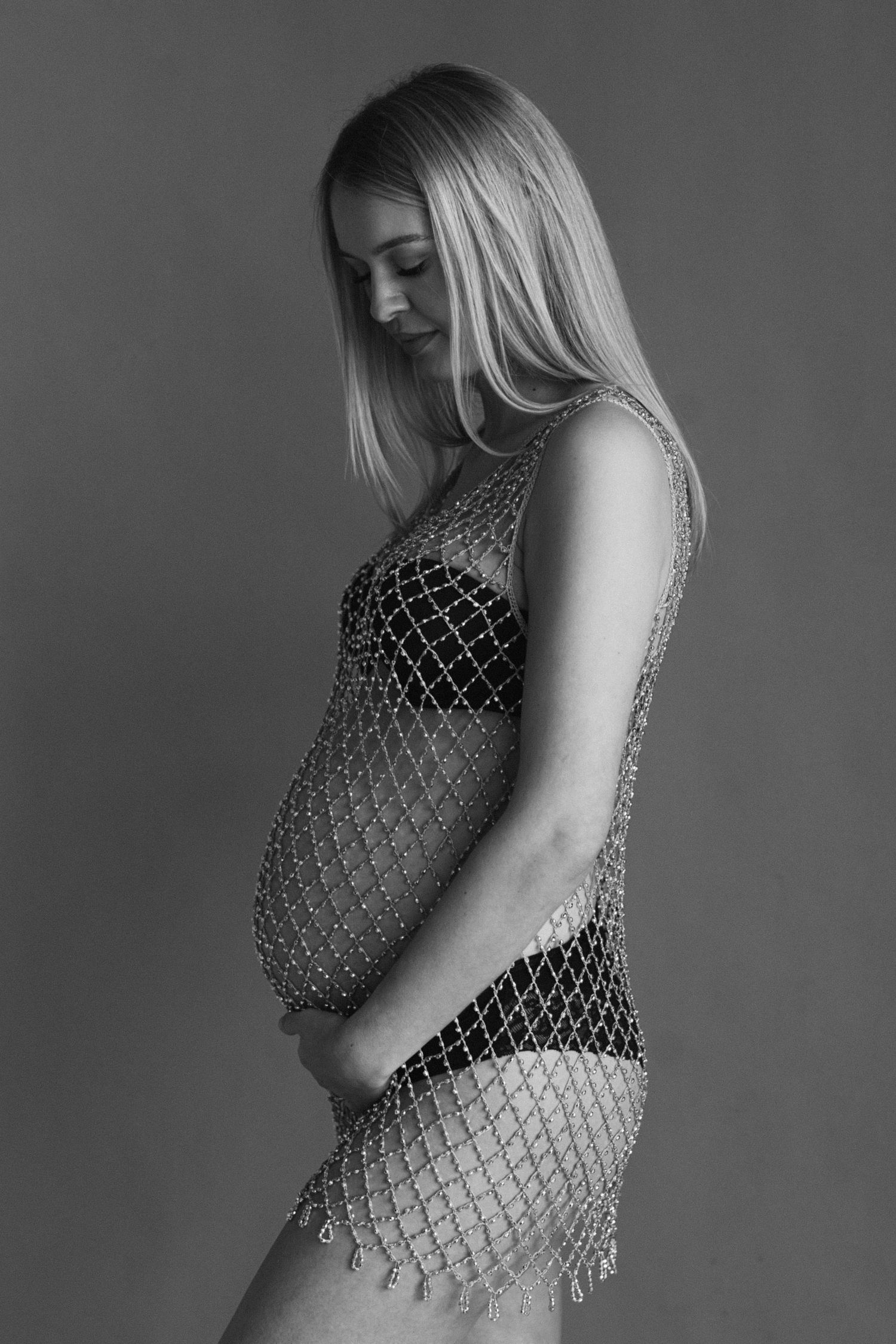 Maternity photos featuring silver metallic mesh overlay.