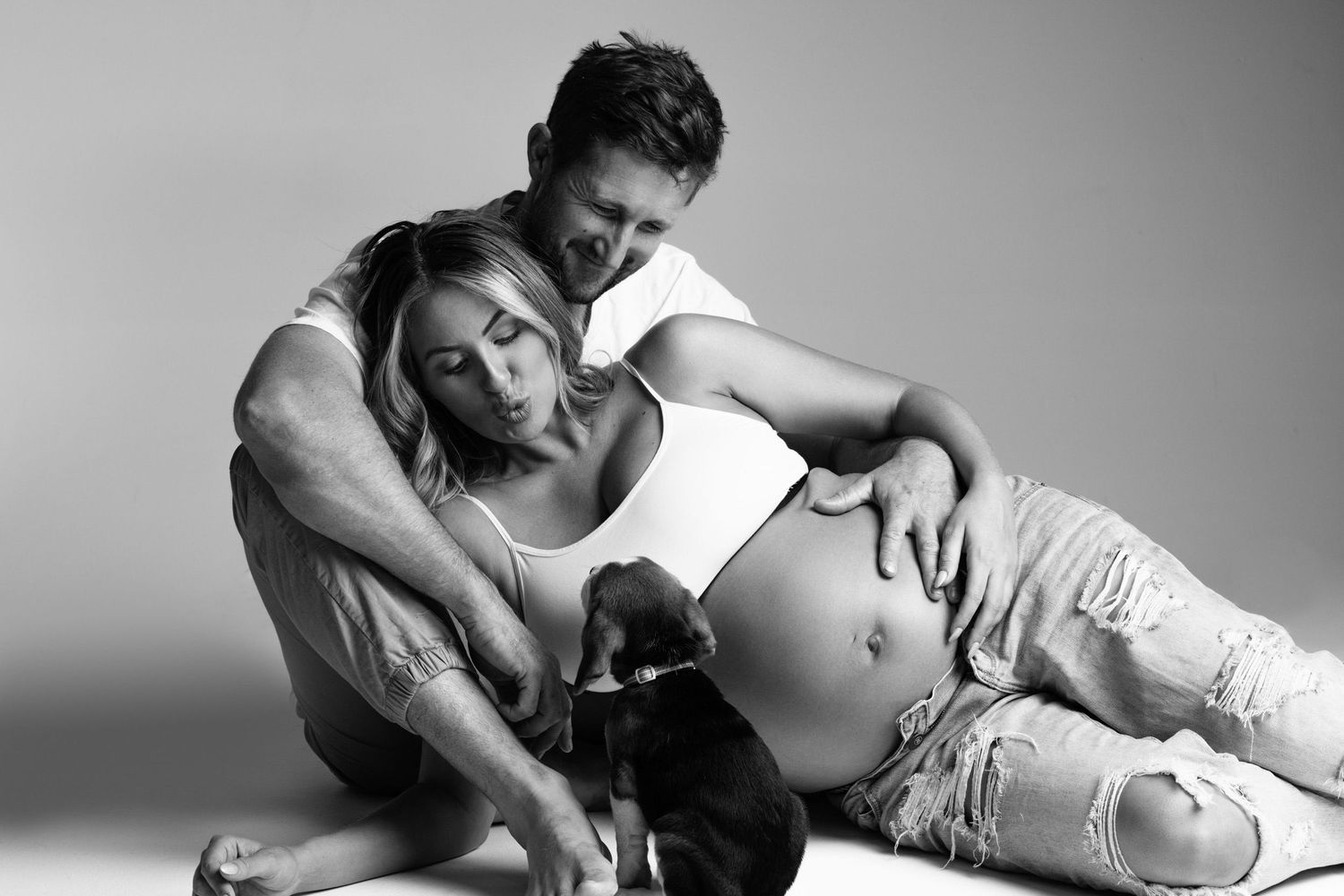 Intimate black and white couple's portrait session with minimalist styling.