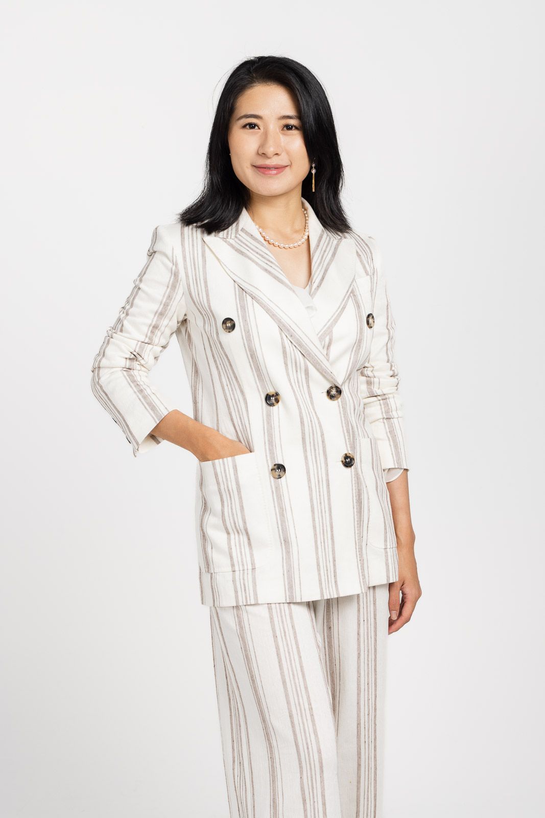 A professional striped linen suit set with brown buttons shown in three different poses against a white background.