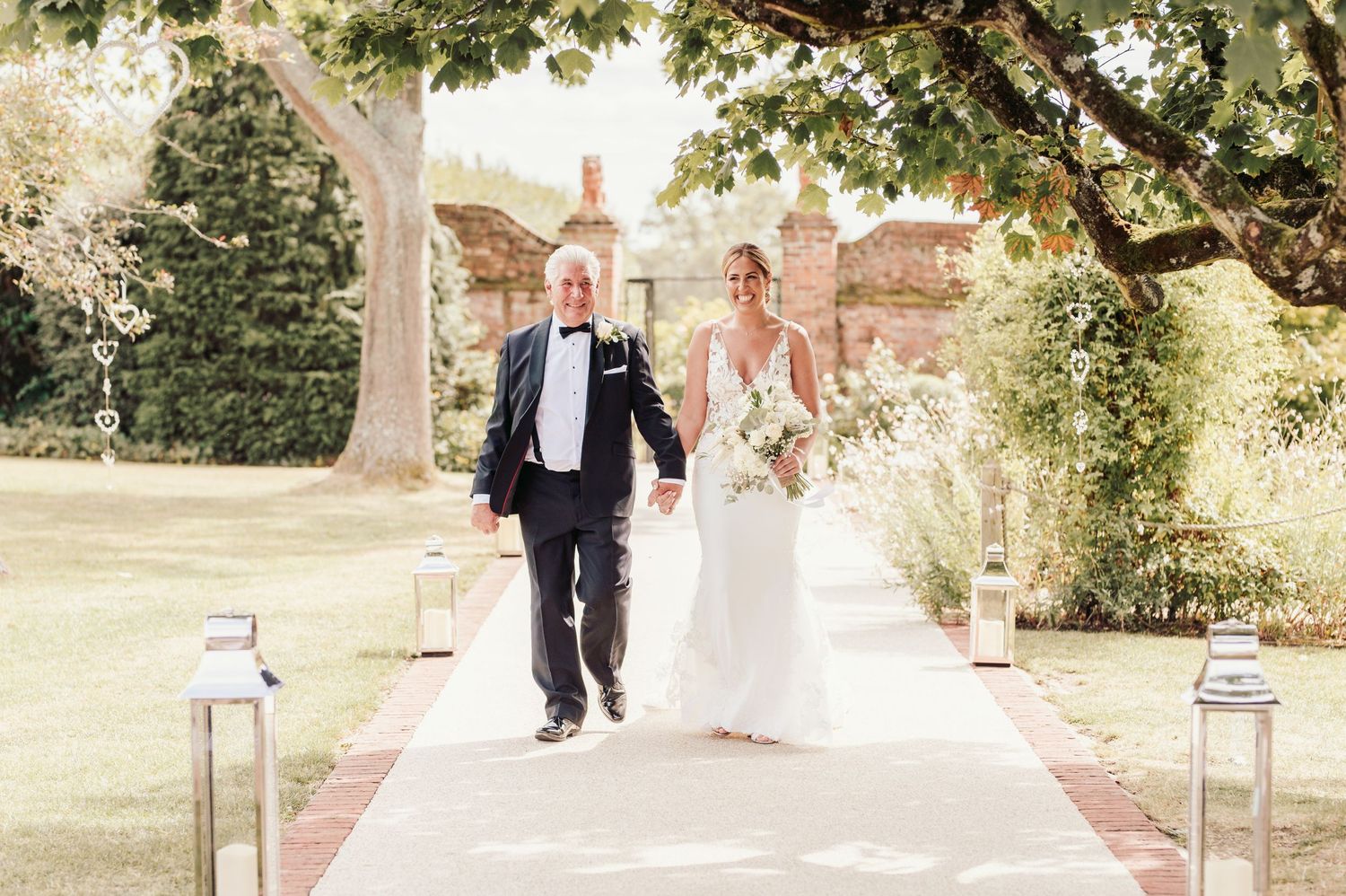 Beautiful wedding at Gaynes Park, Essex, featuring rustic barns, stunning gardens, and romantic outdoor photography in a picturesque setting