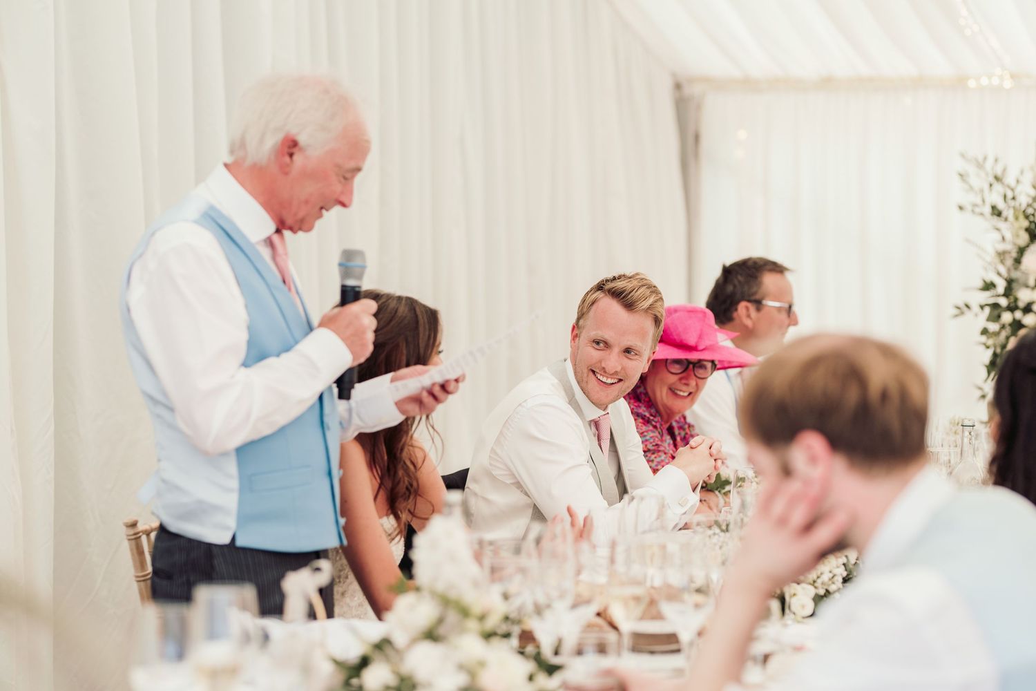 Glemham Hall Wedding Venue in Suffolk Countrysid Exchange Vows in Glemham Hall's Great HallTable Setup in Marquee with Pastel Flowers