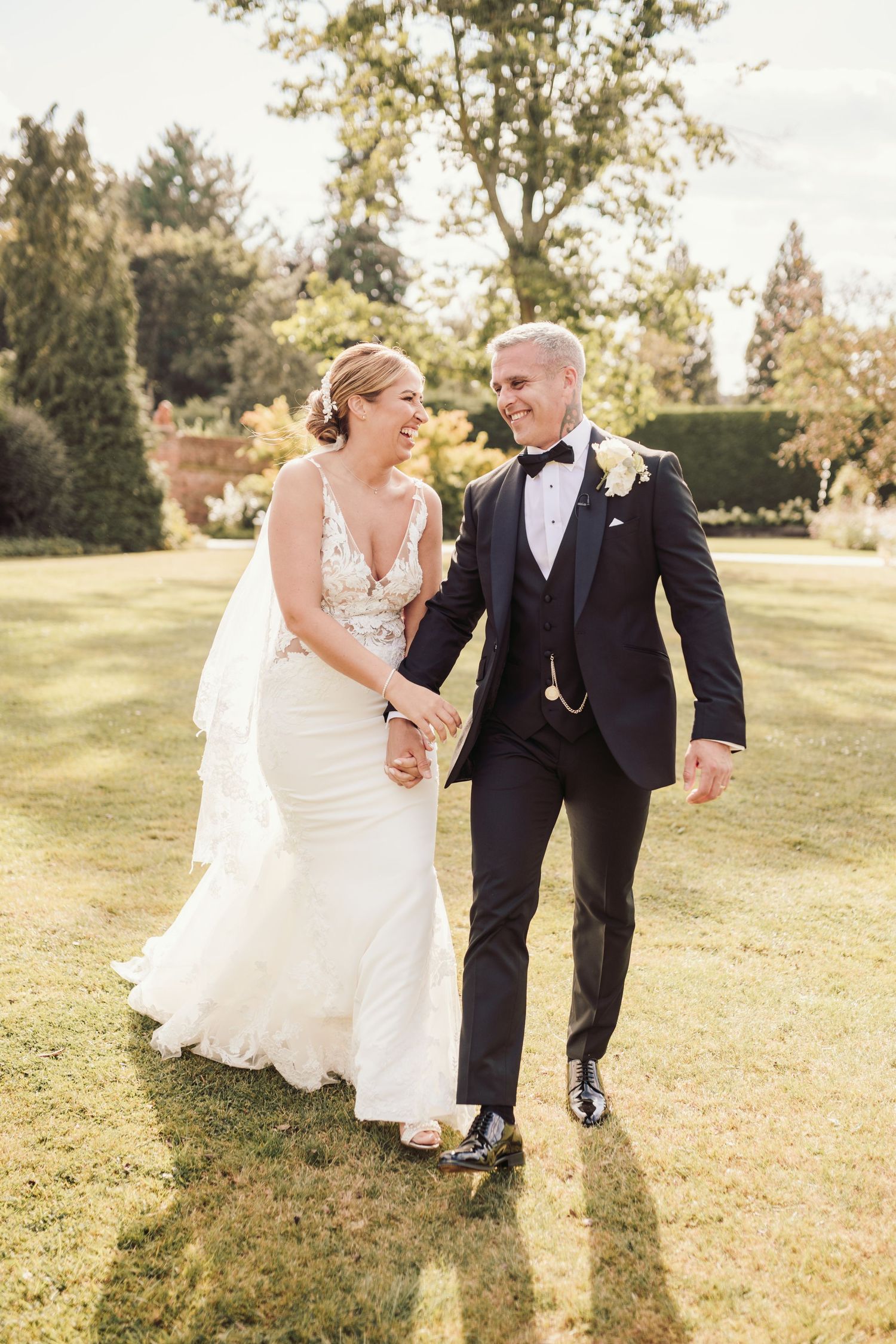 Beautiful wedding at Gaynes Park, Essex, featuring rustic barns, stunning gardens, and romantic outdoor photography in a picturesque setting