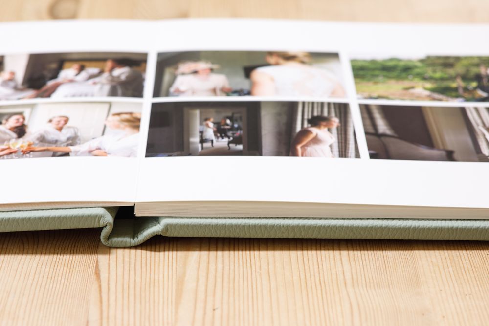 Professional wedding album spread with multiple photographs arranged in a storytelling layout.