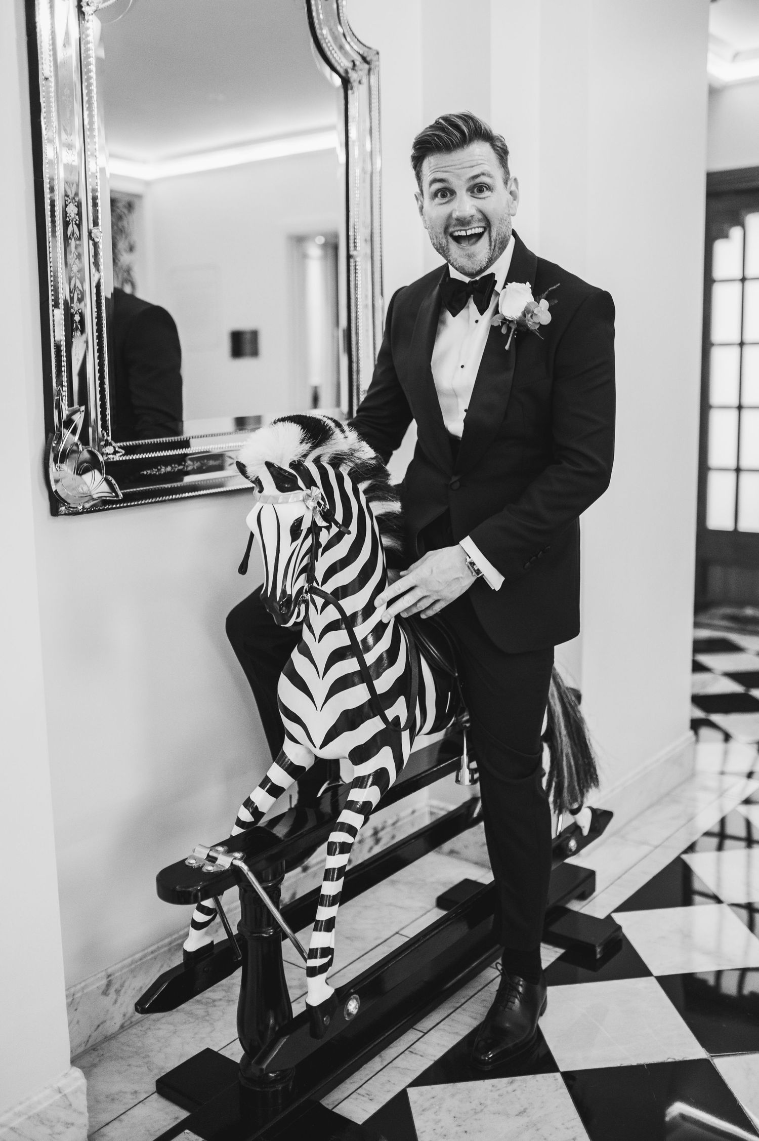 Playful black and white photos with zebra-print decorative bench.