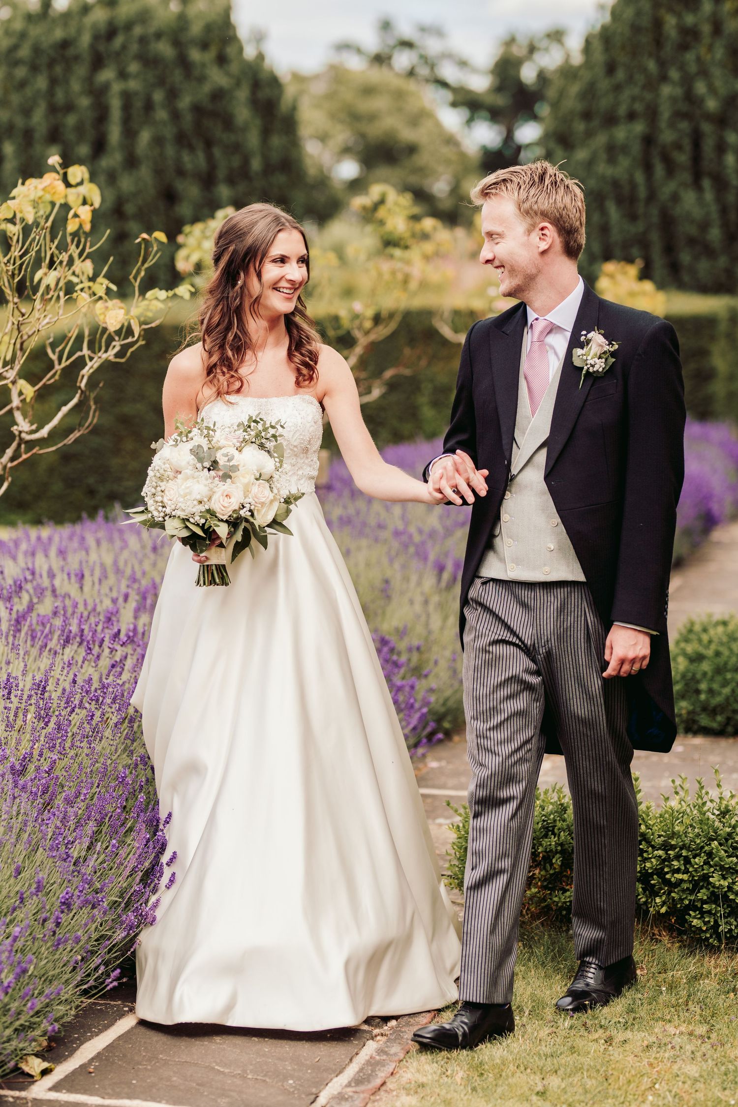 Glemham Hall Wedding Venue in Suffolk Countrysid Exchange Vows in Glemham Hall's Great HallTable Setup in Marquee with Pastel Flowers