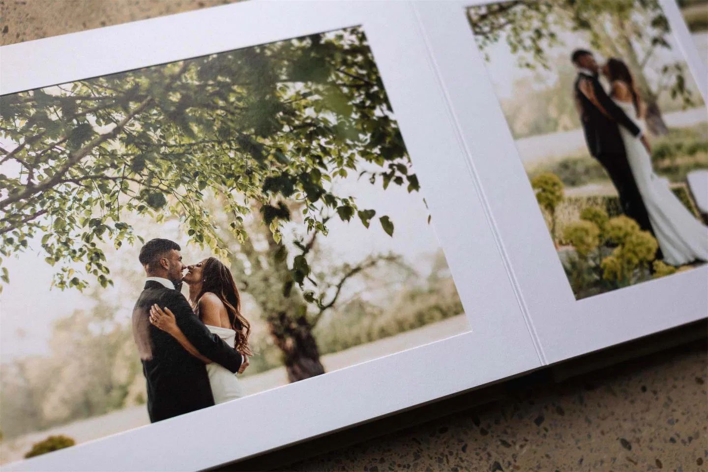 A wedding photo album layout showing multiple black and white images arranged in a grid pattern.