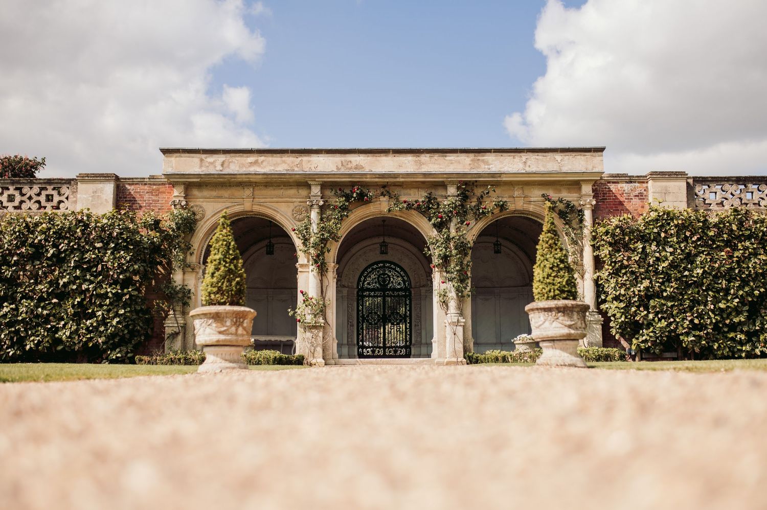 Bride and groom in North Mymms Park's elegant reception hall, perfect for timeless wedding photography.