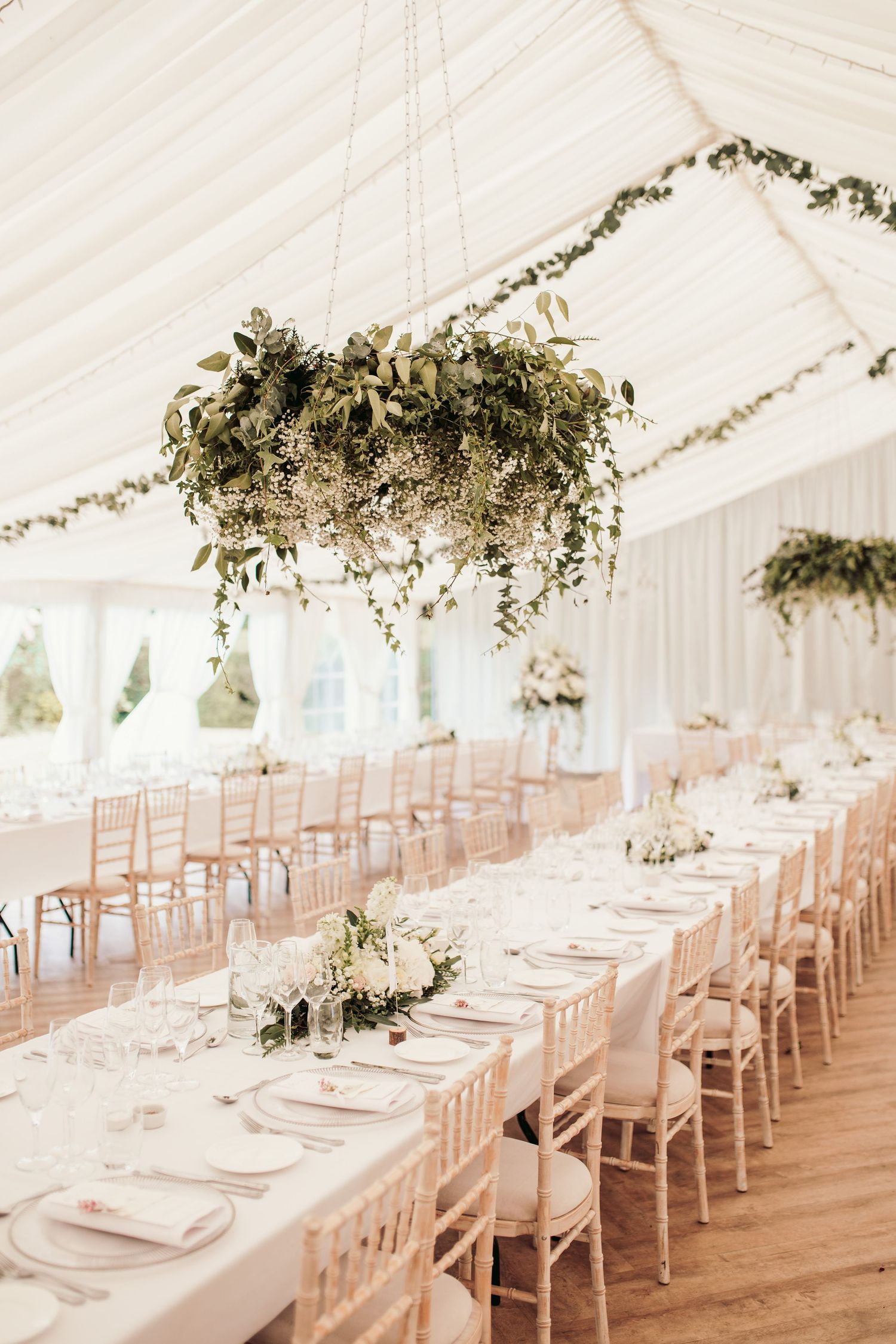 Glemham Hall Wedding Venue in Suffolk Countrysid Exchange Vows in Glemham Hall's Great HallTable Setup in Marquee with Pastel Flowers