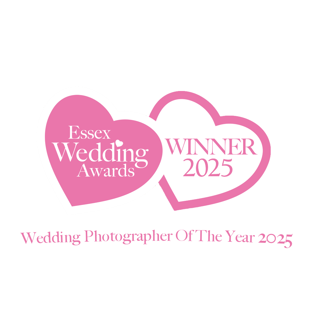 Pink heart-shaped wedding photographer award logo for Essex 2025.
