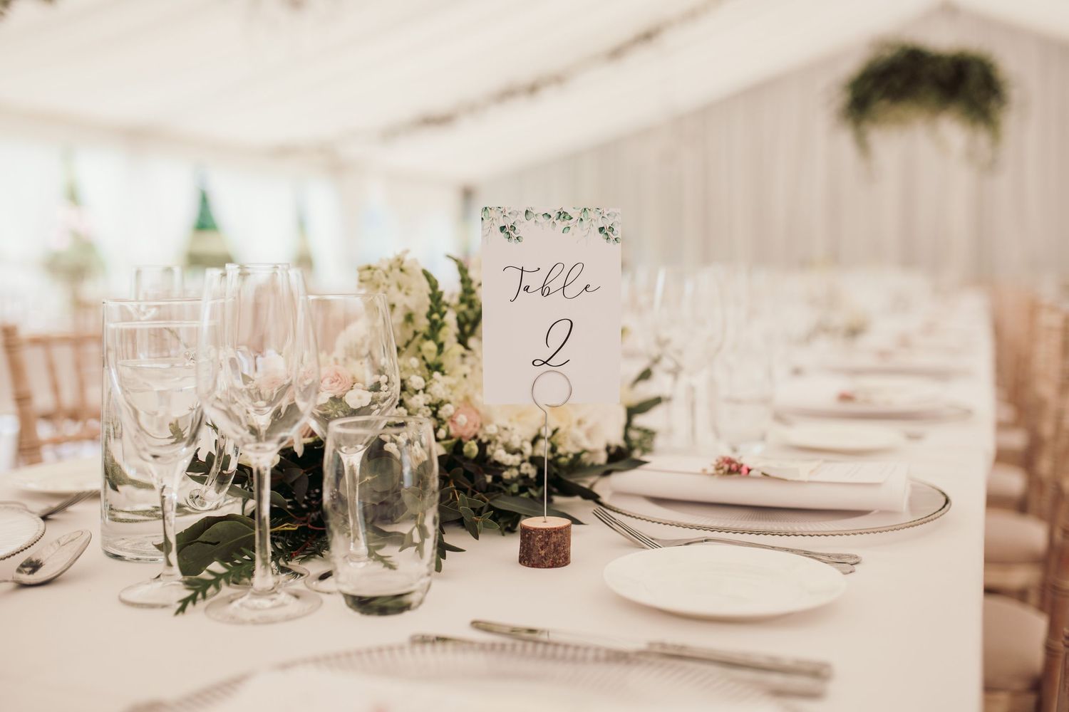 Glemham Hall Wedding Venue in Suffolk Countrysid Exchange Vows in Glemham Hall's Great HallTable Setup in Marquee with Pastel Flowers