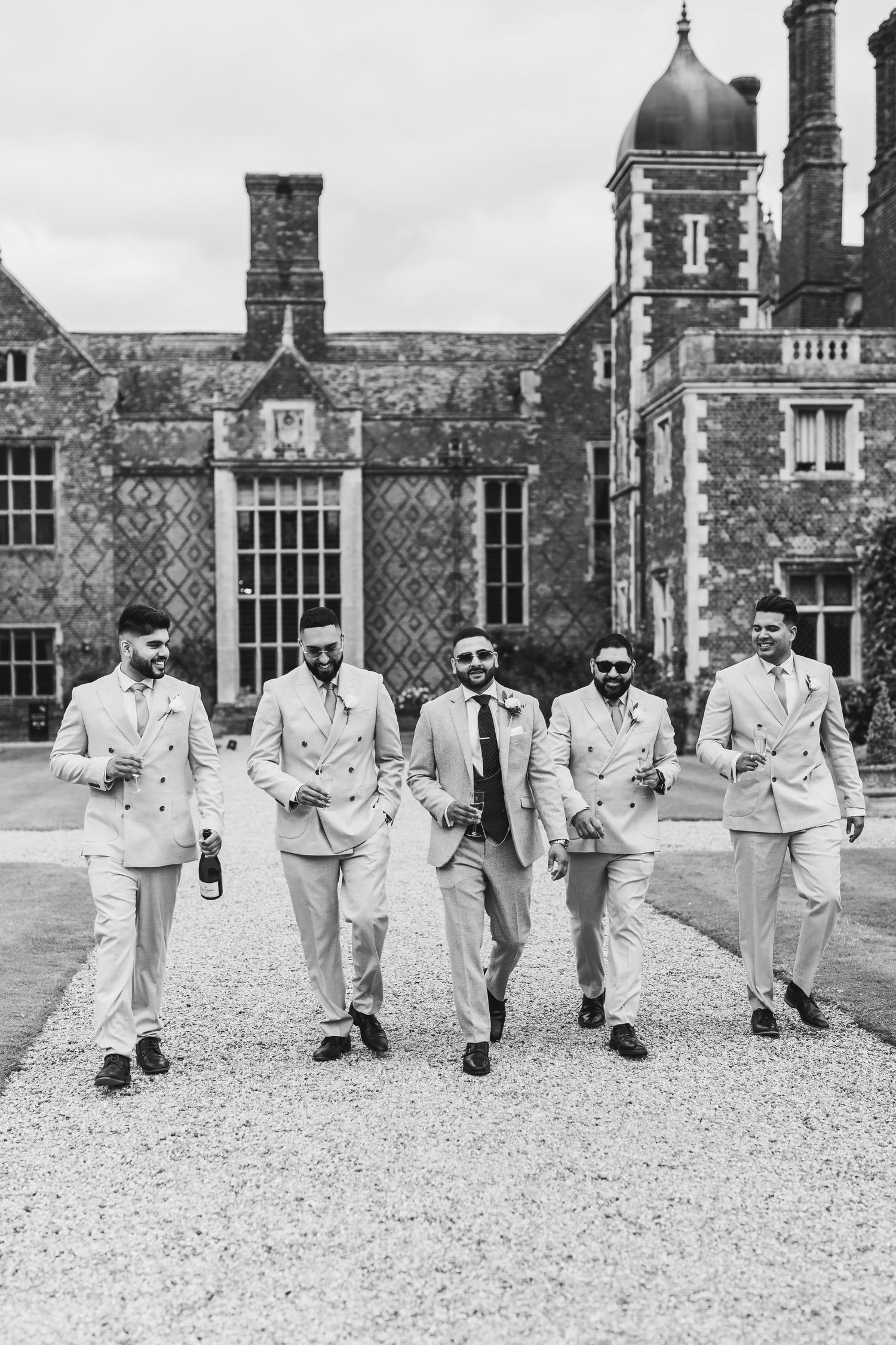 Candid wedding photography in the lush gardens of North Mymms Park, Hertfordshire