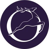 Minimalist circular logo with leaping deer silhouette in white against dark purple background.