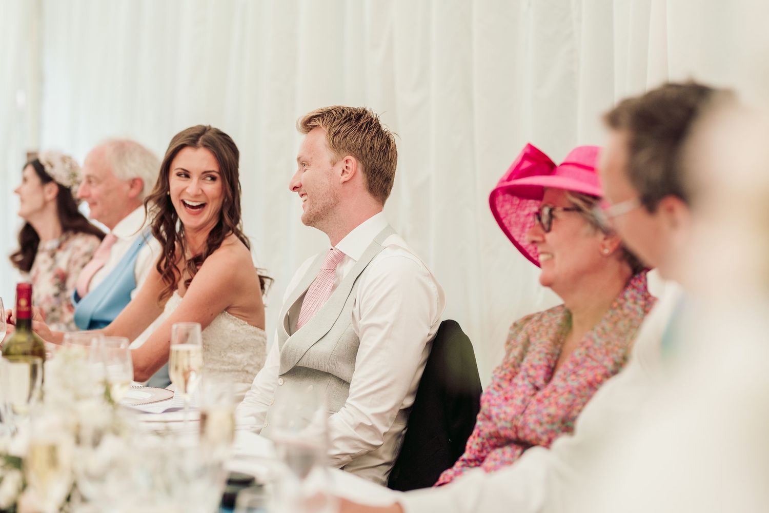 Glemham Hall Wedding Venue in Suffolk Countrysid Exchange Vows in Glemham Hall's Great HallTable Setup in Marquee with Pastel Flowers