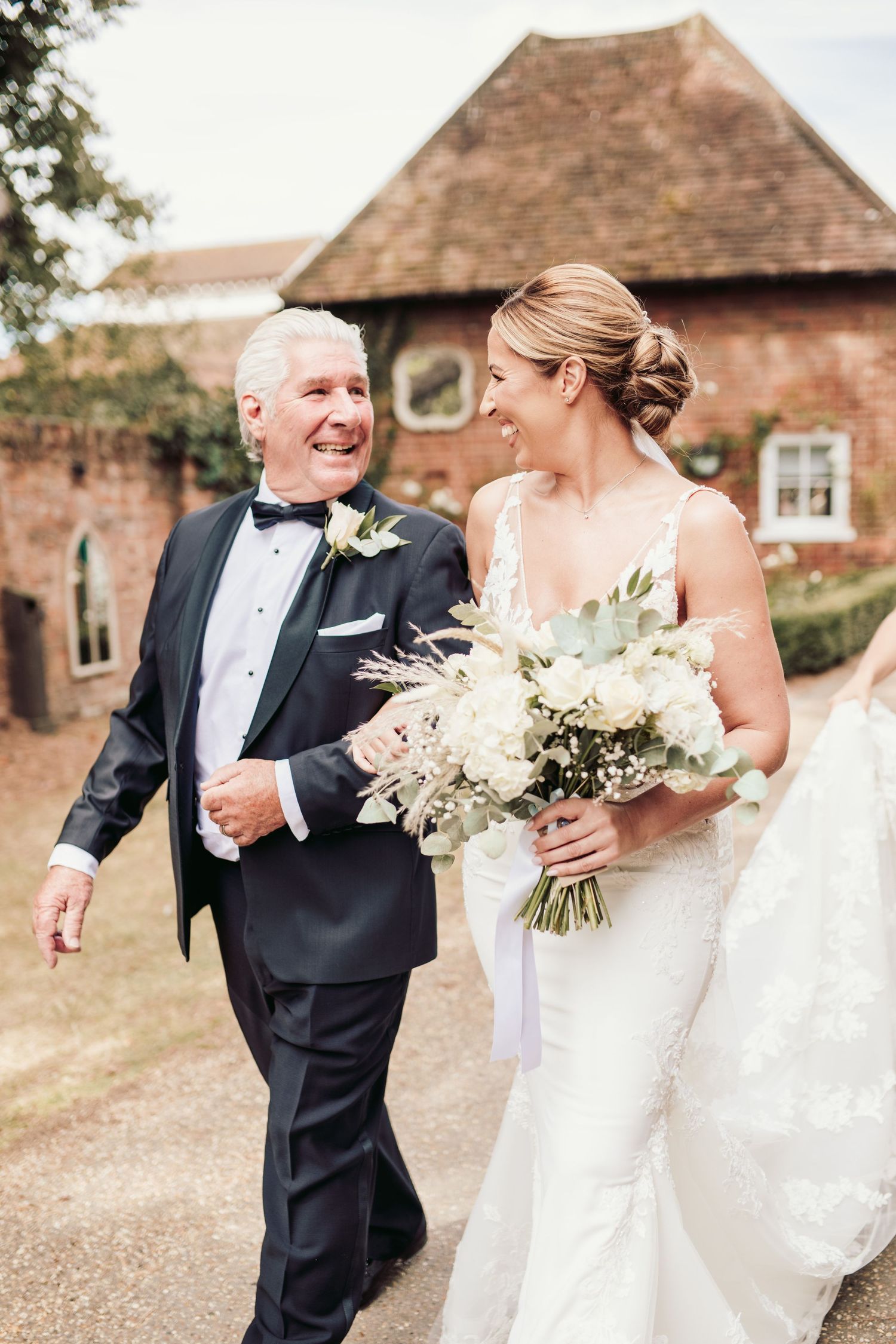 Beautiful wedding at Gaynes Park, Essex, featuring rustic barns, stunning gardens, and romantic outdoor photography in a picturesque setting