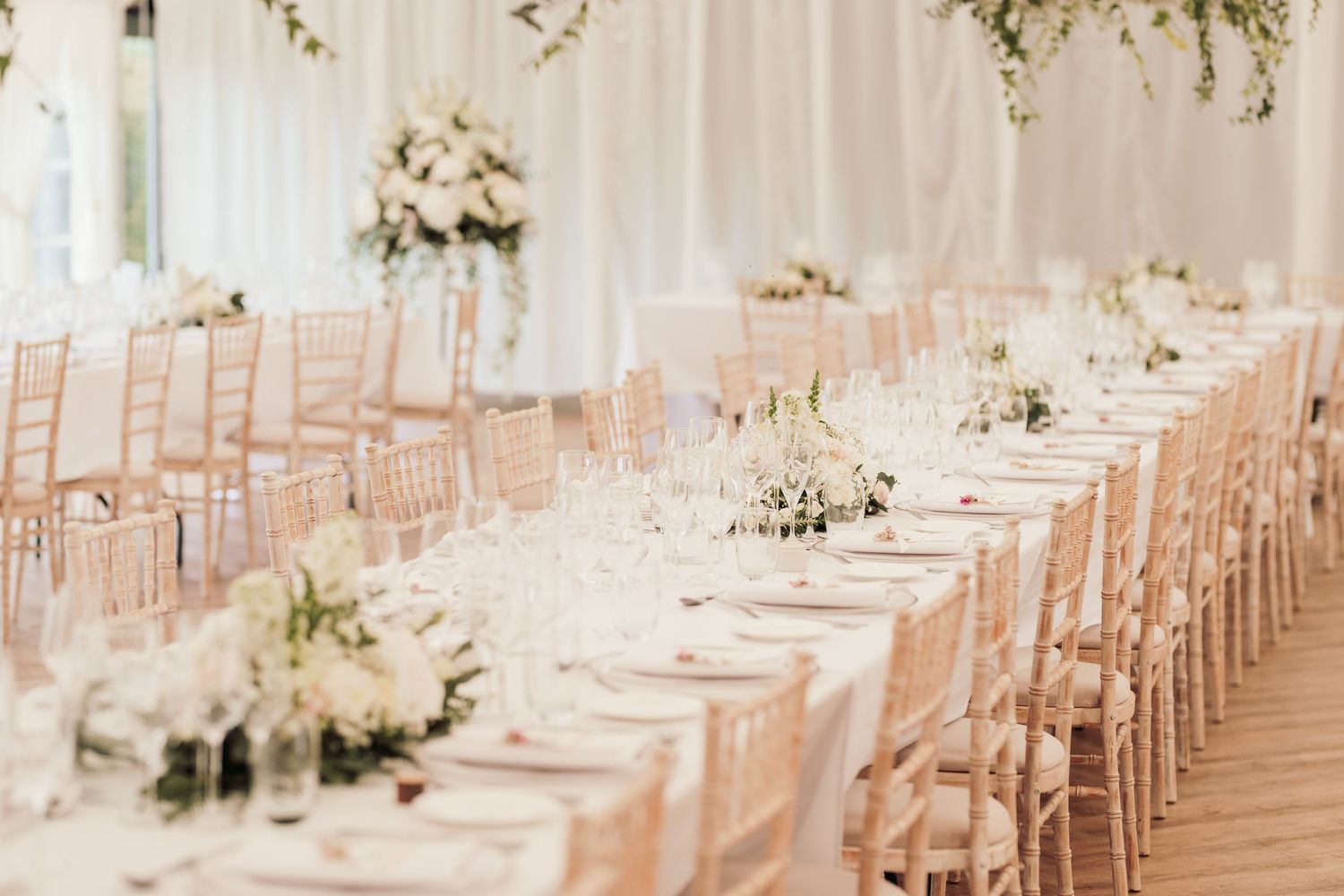 Glemham Hall Wedding Venue in Suffolk Countrysid Exchange Vows in Glemham Hall's Great HallTable Setup in Marquee with Pastel Flowers