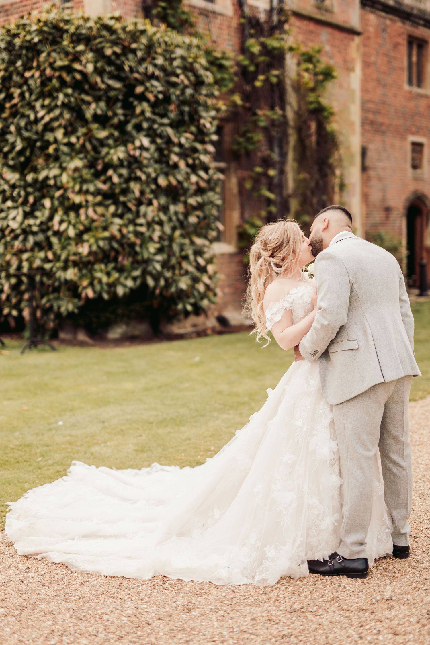 Bride and groom in North Mymms Park's elegant reception hall, perfect for timeless wedding photography.