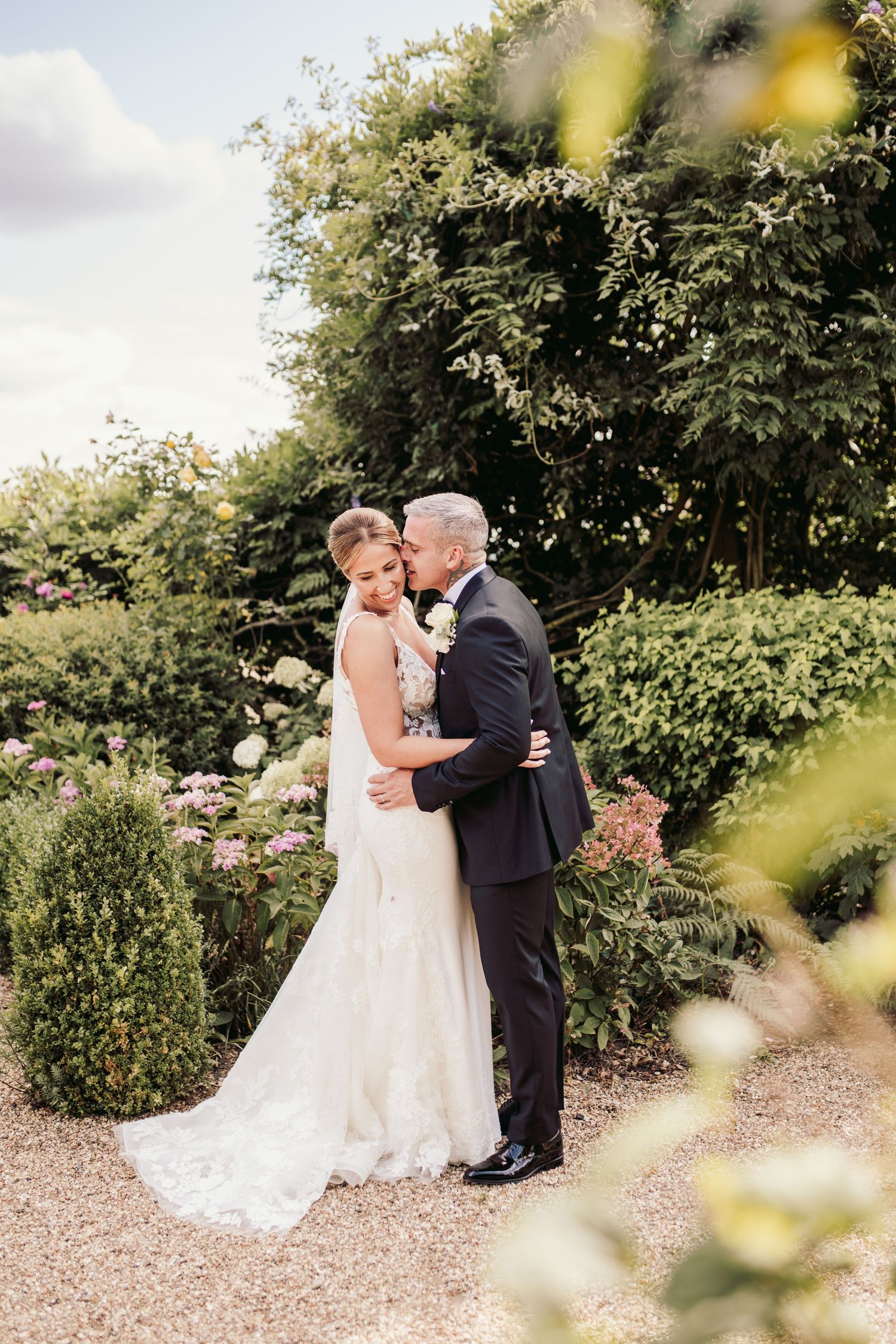Beautiful wedding at Gaynes Park, Essex, featuring rustic barns, stunning gardens, and romantic outdoor photography in a picturesque setting