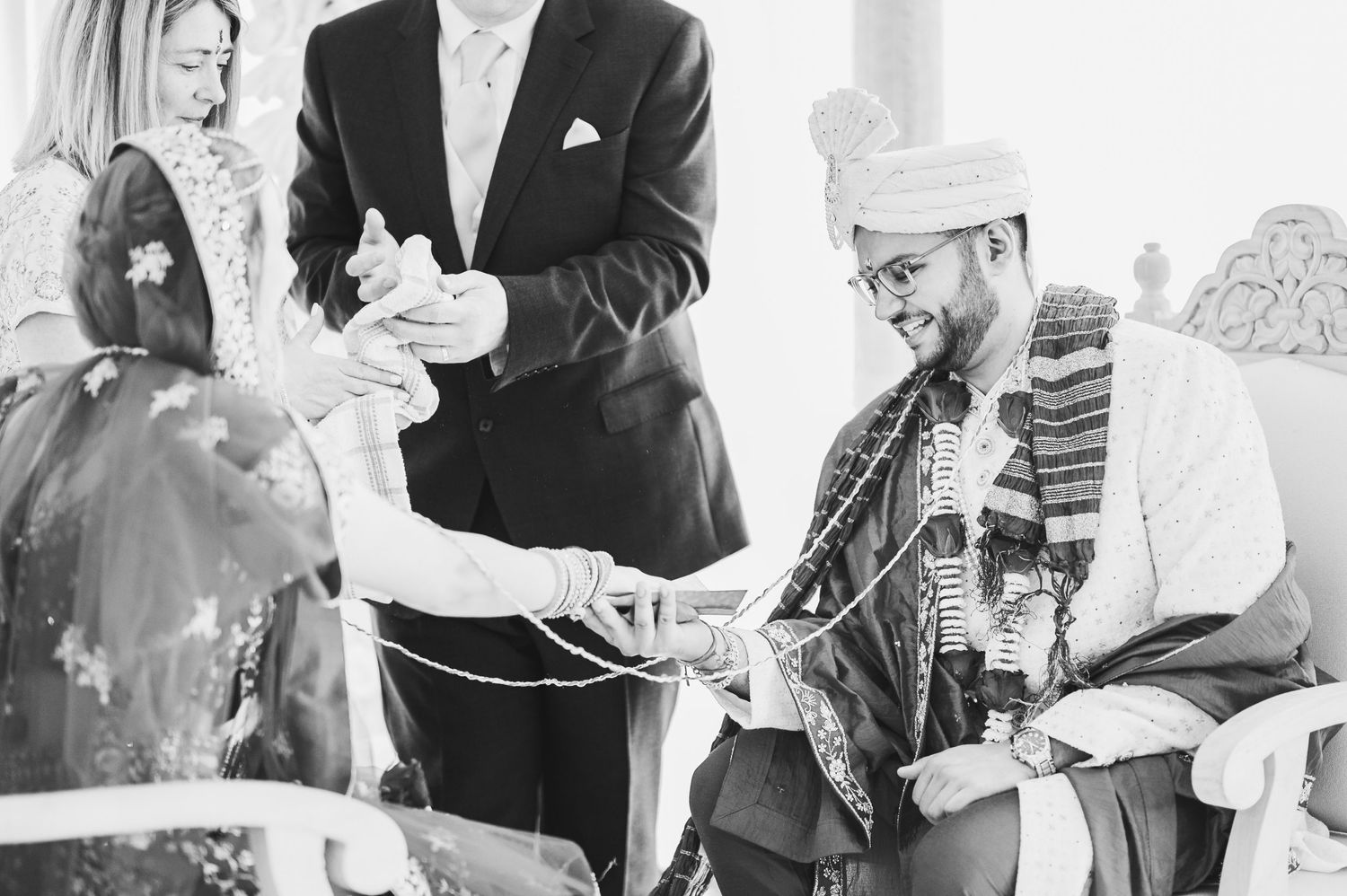 Black and white photograph of musicians performing together at an event in formal attire.