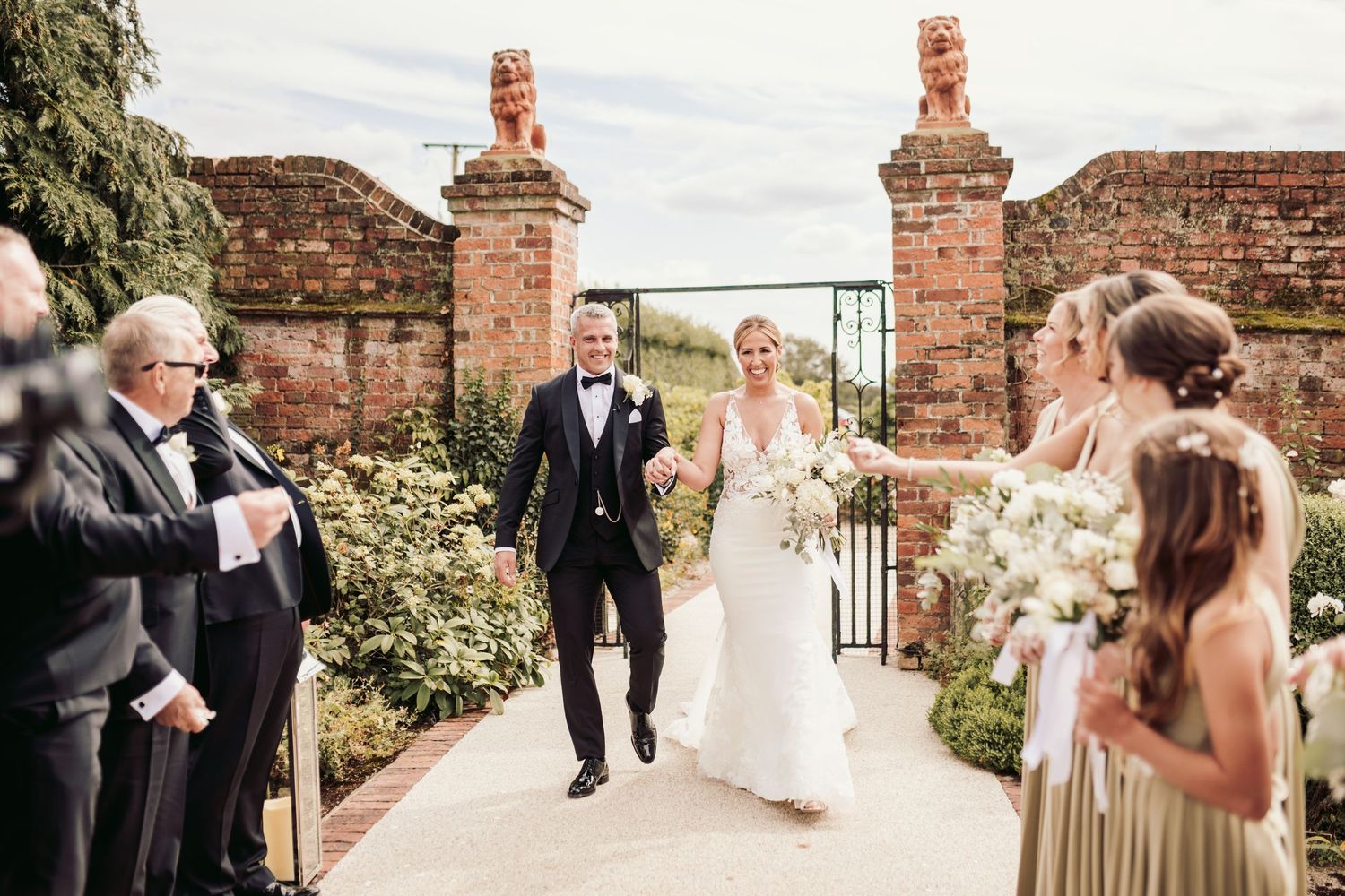 Beautiful wedding at Gaynes Park, Essex, featuring rustic barns, stunning gardens, and romantic outdoor photography in a picturesque setting