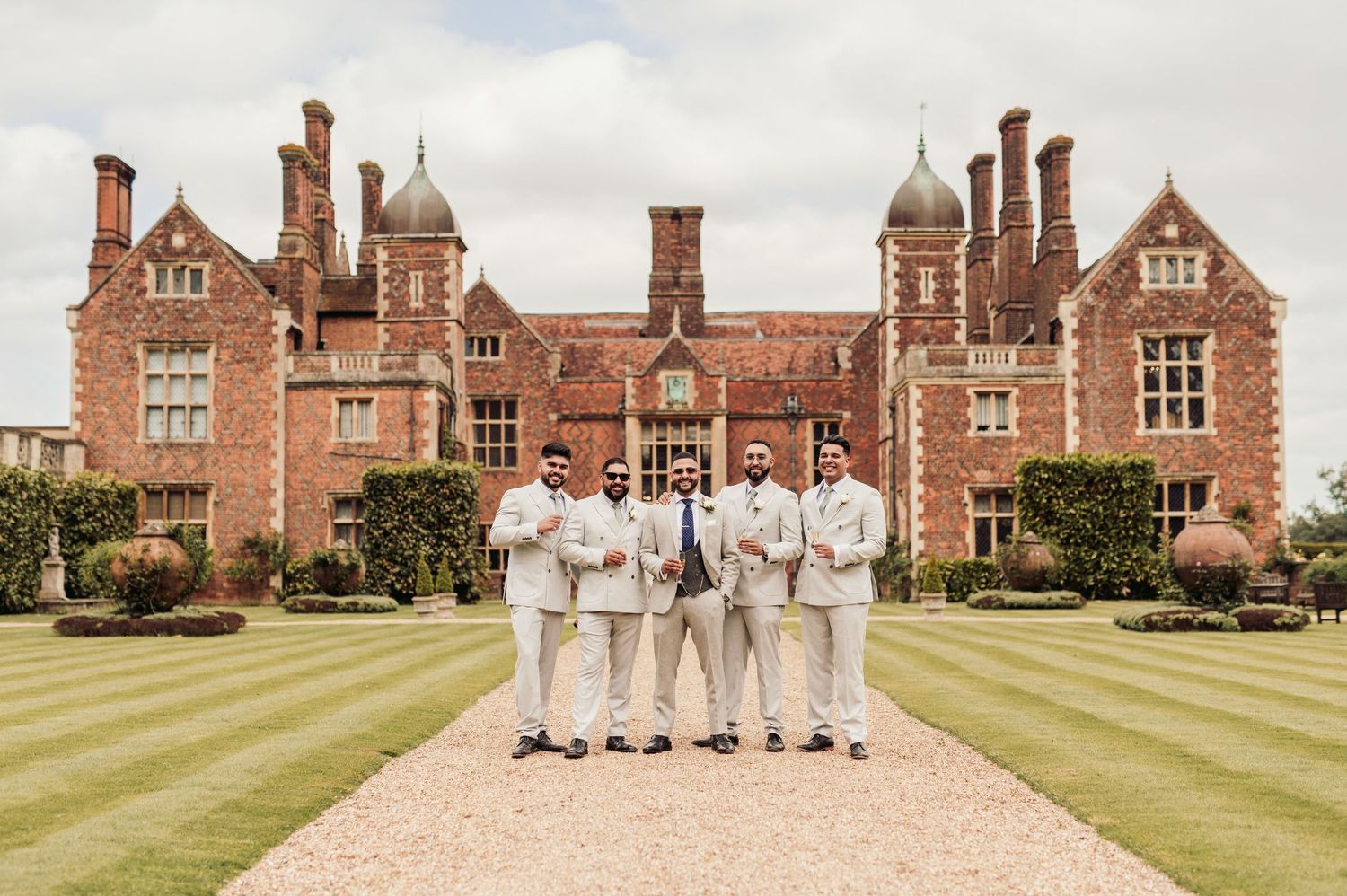 Candid wedding photography in the lush gardens of North Mymms Park, Hertfordshire