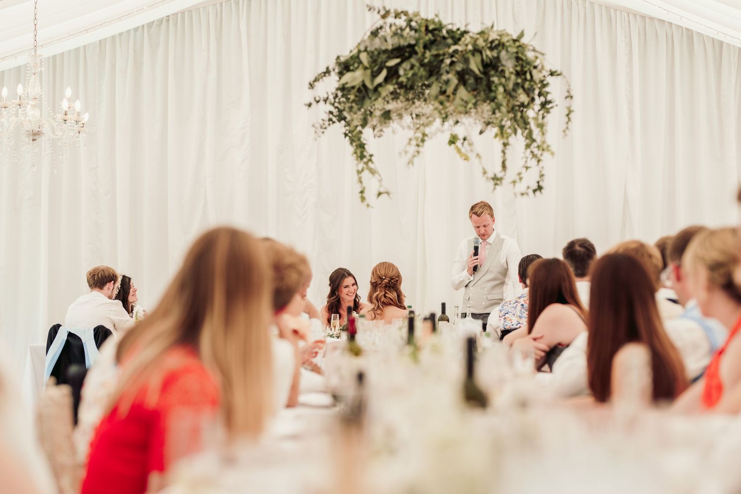Glemham Hall Wedding Venue in Suffolk Countrysid Exchange Vows in Glemham Hall's Great HallTable Setup in Marquee with Pastel Flowers