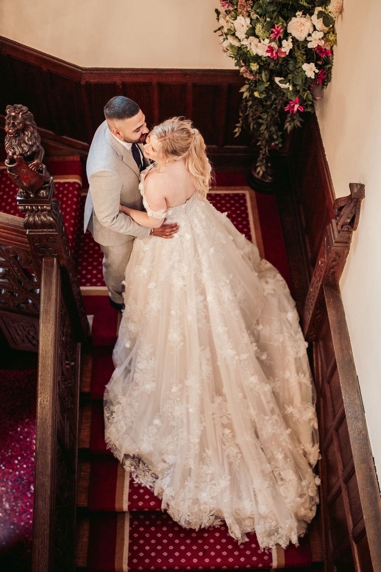 Bride and groom in North Mymms Park's elegant reception hall, perfect for timeless wedding photography.