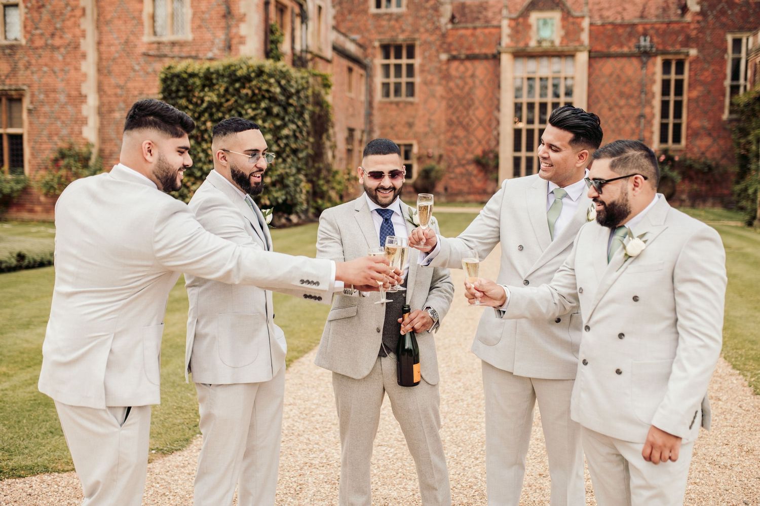 Candid wedding photography in the lush gardens of North Mymms Park, Hertfordshire