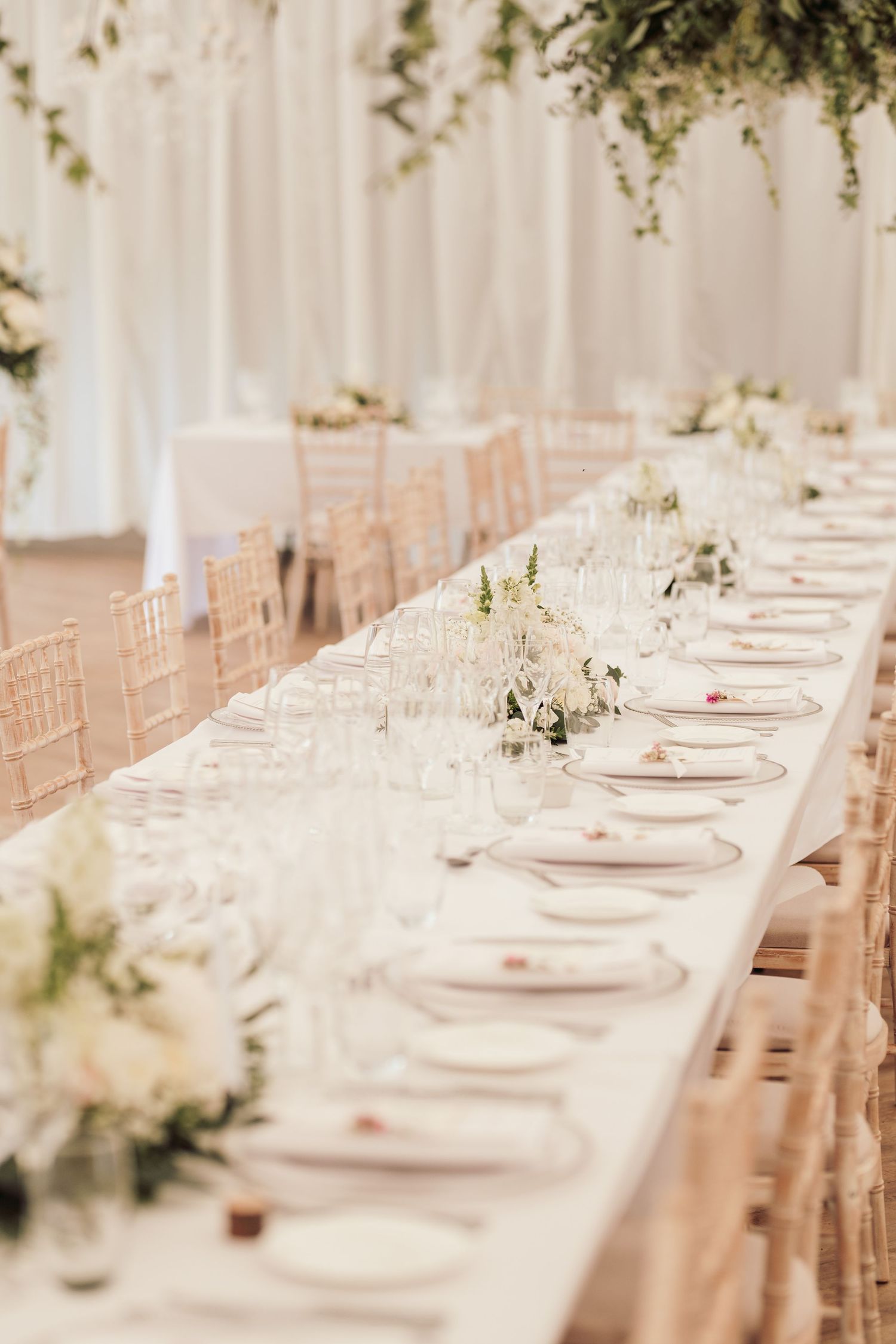 Glemham Hall Wedding Venue in Suffolk Countrysid Exchange Vows in Glemham Hall's Great HallTable Setup in Marquee with Pastel Flowers