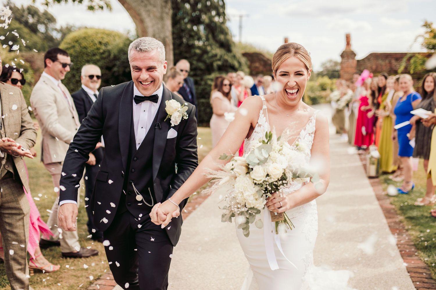 Beautiful wedding at Gaynes Park, Essex, featuring rustic barns, stunning gardens, and romantic outdoor photography in a picturesque setting