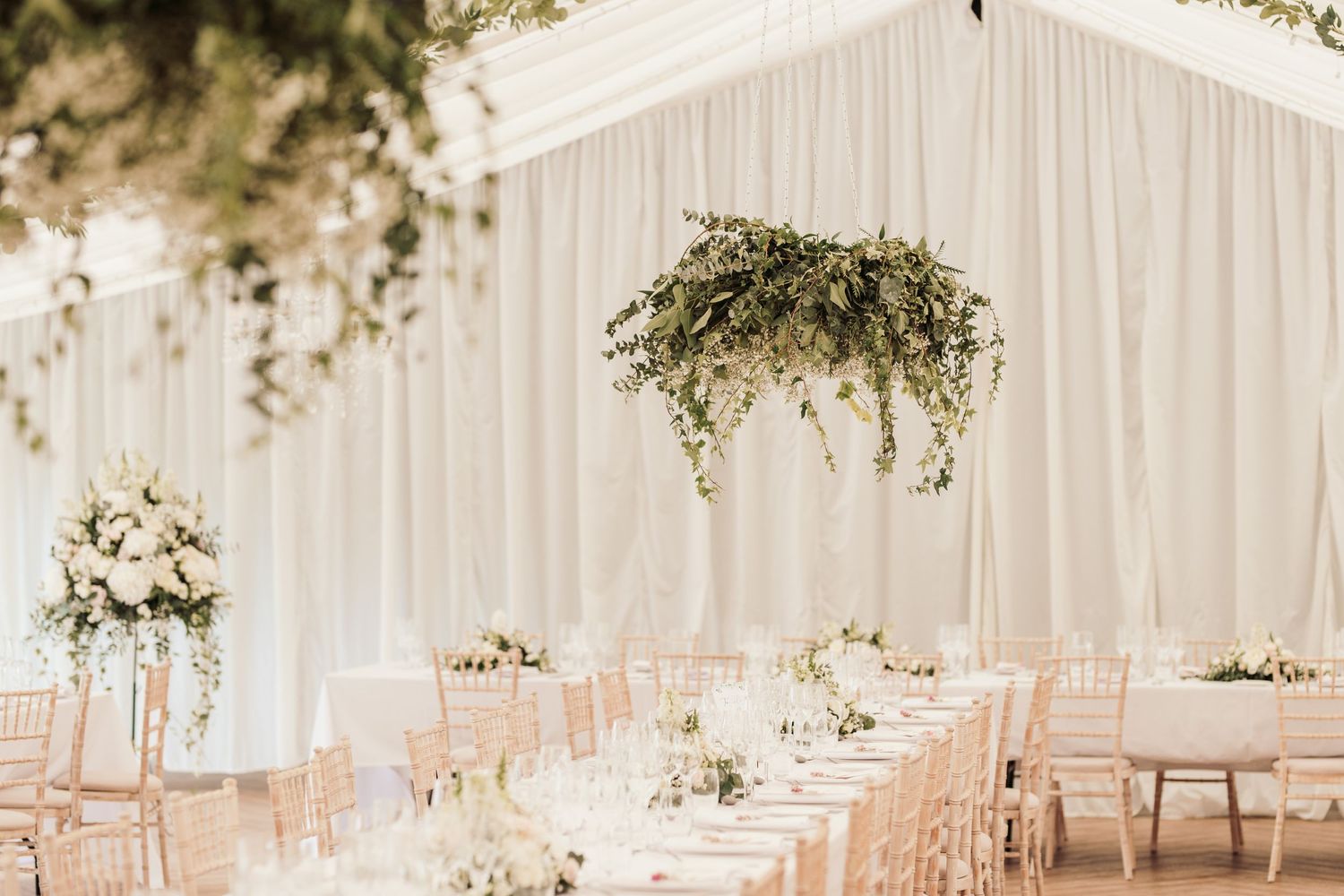 Glemham Hall Wedding Venue in Suffolk Countrysid Exchange Vows in Glemham Hall's Great HallTable Setup in Marquee with Pastel Flowers