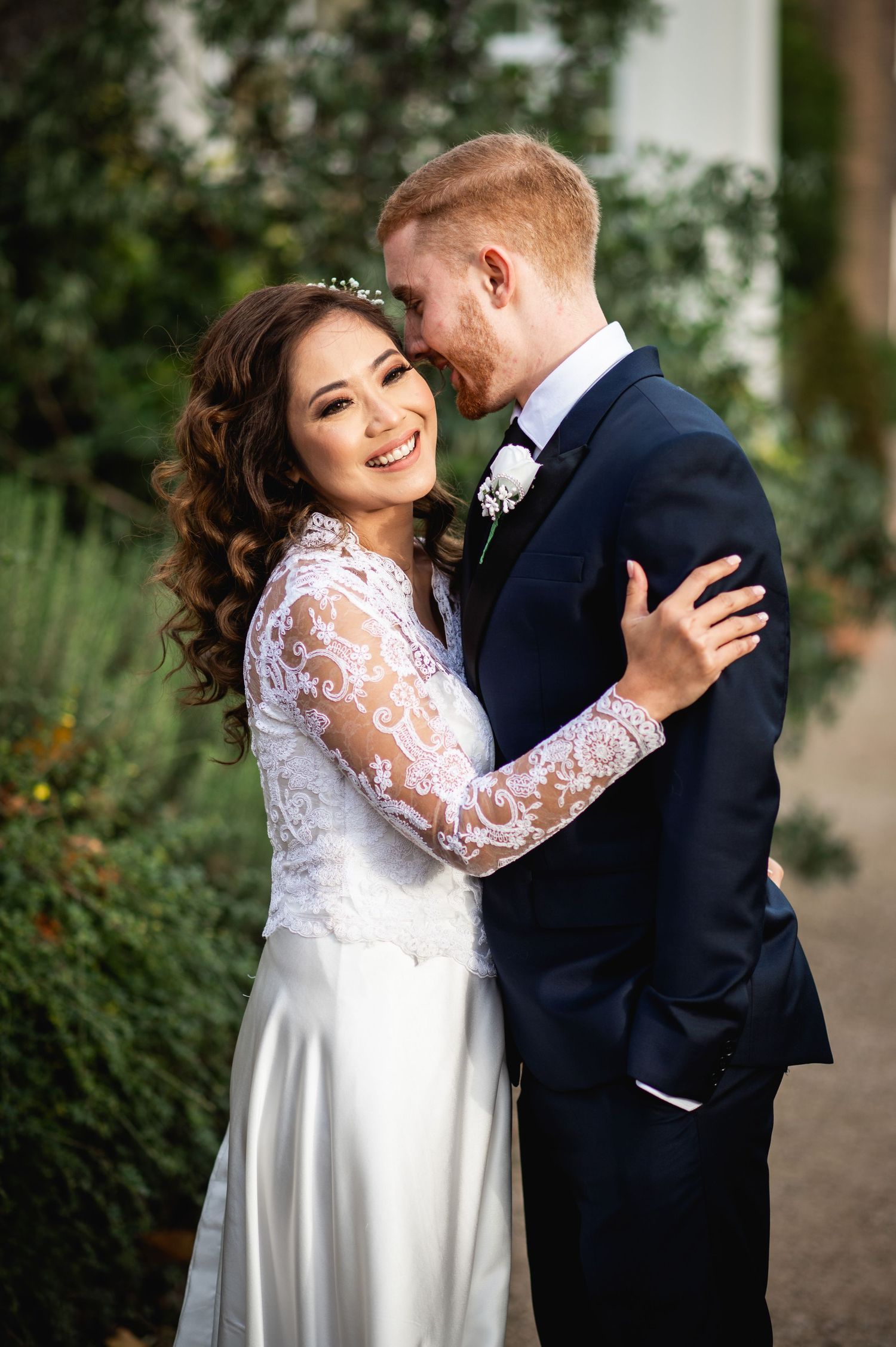 Intimate wedding portraits showing joyful moments between newlyweds.