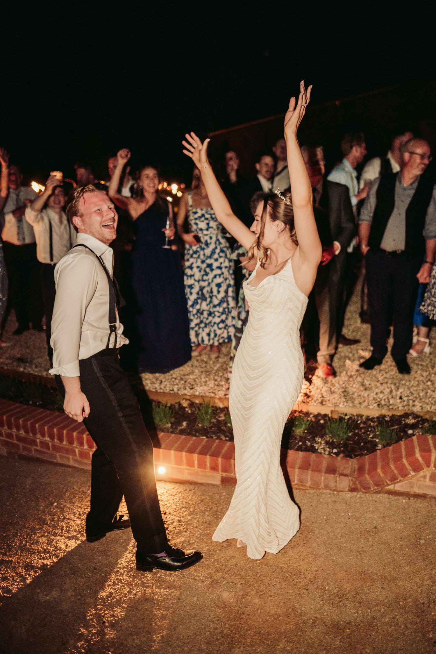 A sequence of photos showing wedding guests dancing and celebrating at a nighttime outdoor reception.