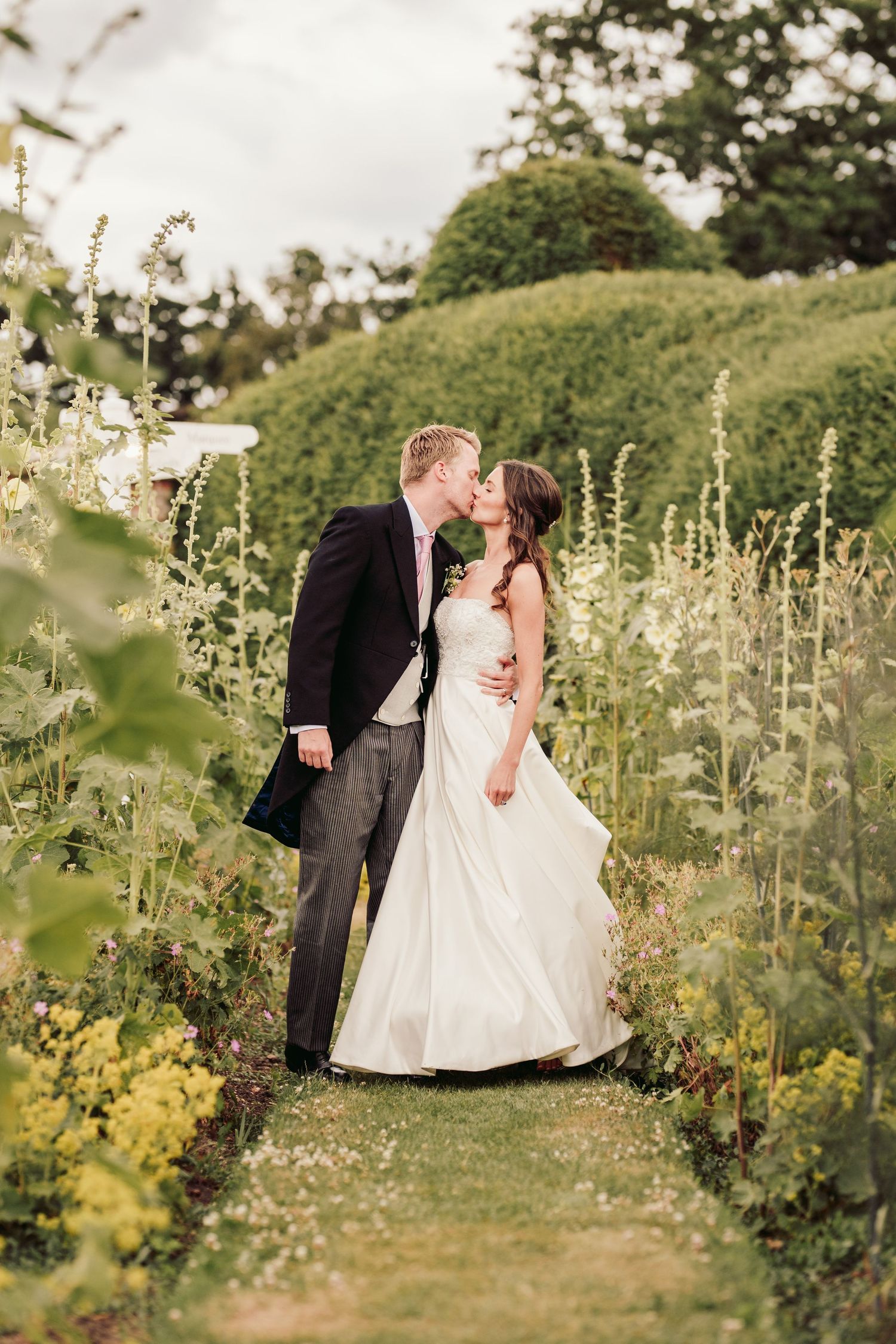 Glemham Hall Wedding Venue in Suffolk Countrysid Exchange Vows in Glemham Hall's Great HallTable Setup in Marquee with Pastel Flowers