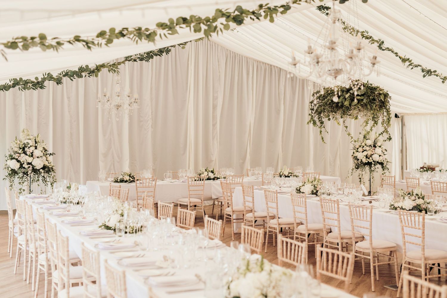 Glemham Hall Wedding Venue in Suffolk Countrysid Exchange Vows in Glemham Hall's Great HallTable Setup in Marquee with Pastel Flowers