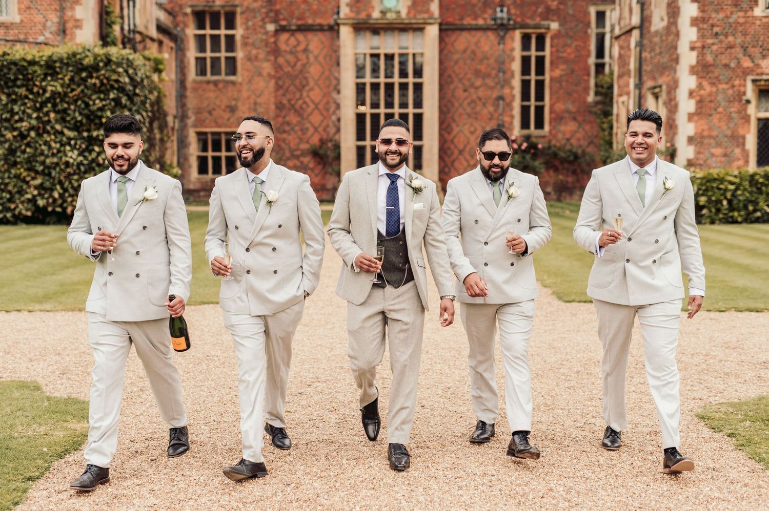Candid wedding photography in the lush gardens of North Mymms Park, Hertfordshire