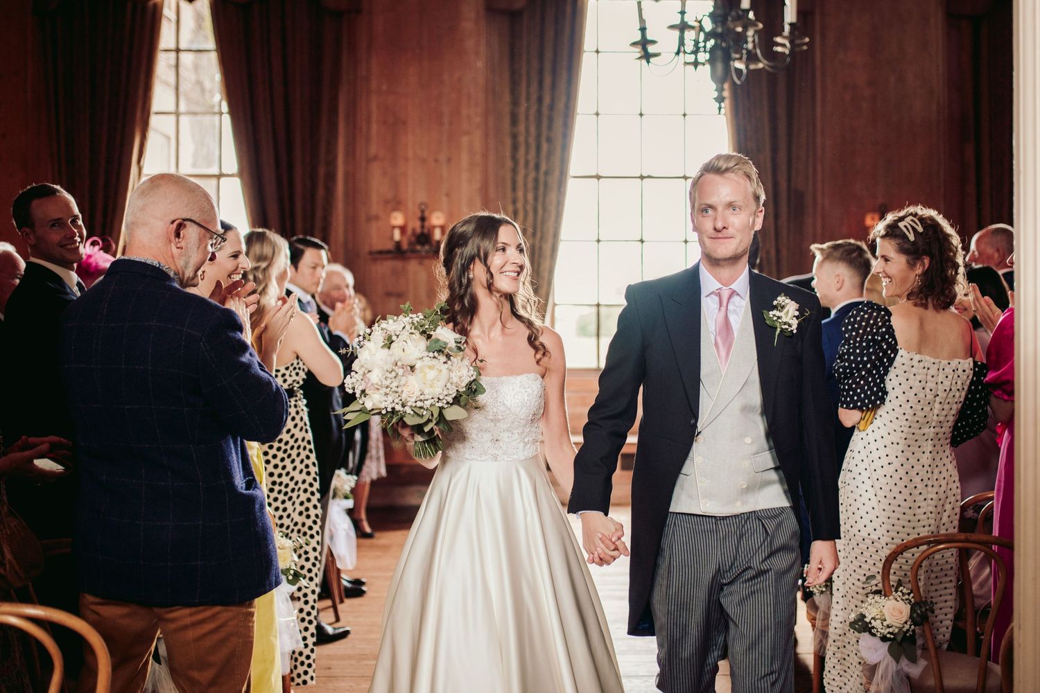 Glemham Hall Wedding Venue in Suffolk Countrysid Exchange Vows in Glemham Hall's Great HallTable Setup in Marquee with Pastel Flowers