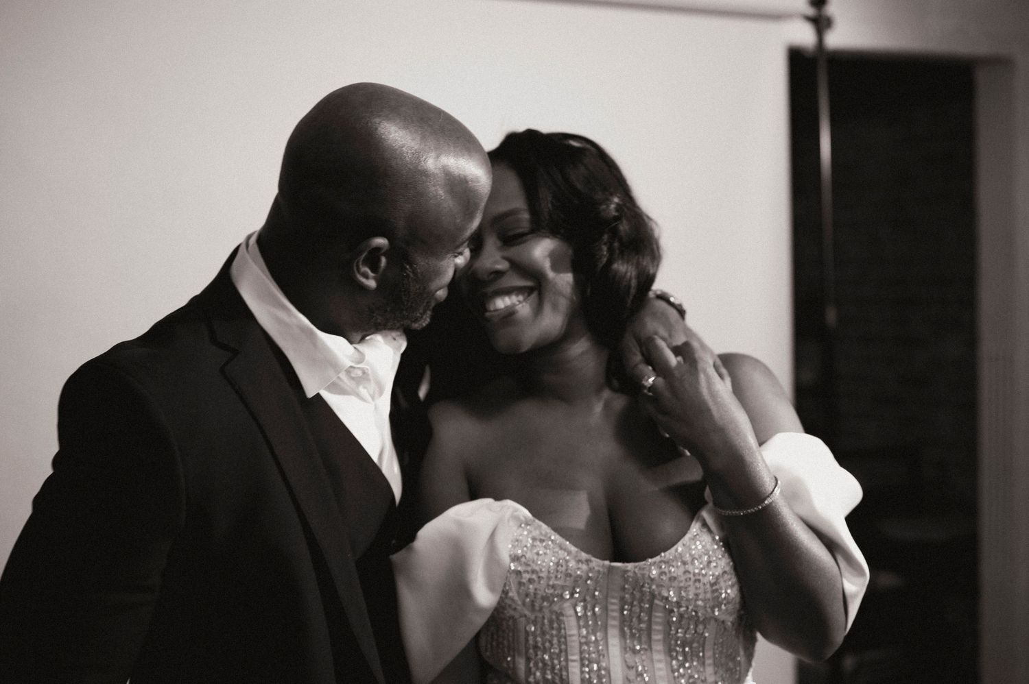 A romantic dance sequence captured in black and white at a wedding reception.