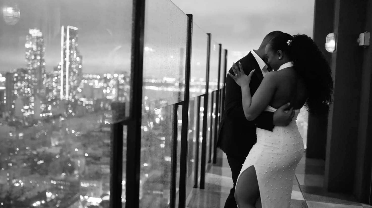 Urban nighttime photography series featuring city lights and engaged couple dancing.