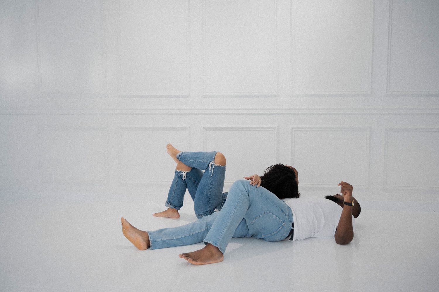 A minimalist photo series showing movement across a white floor.