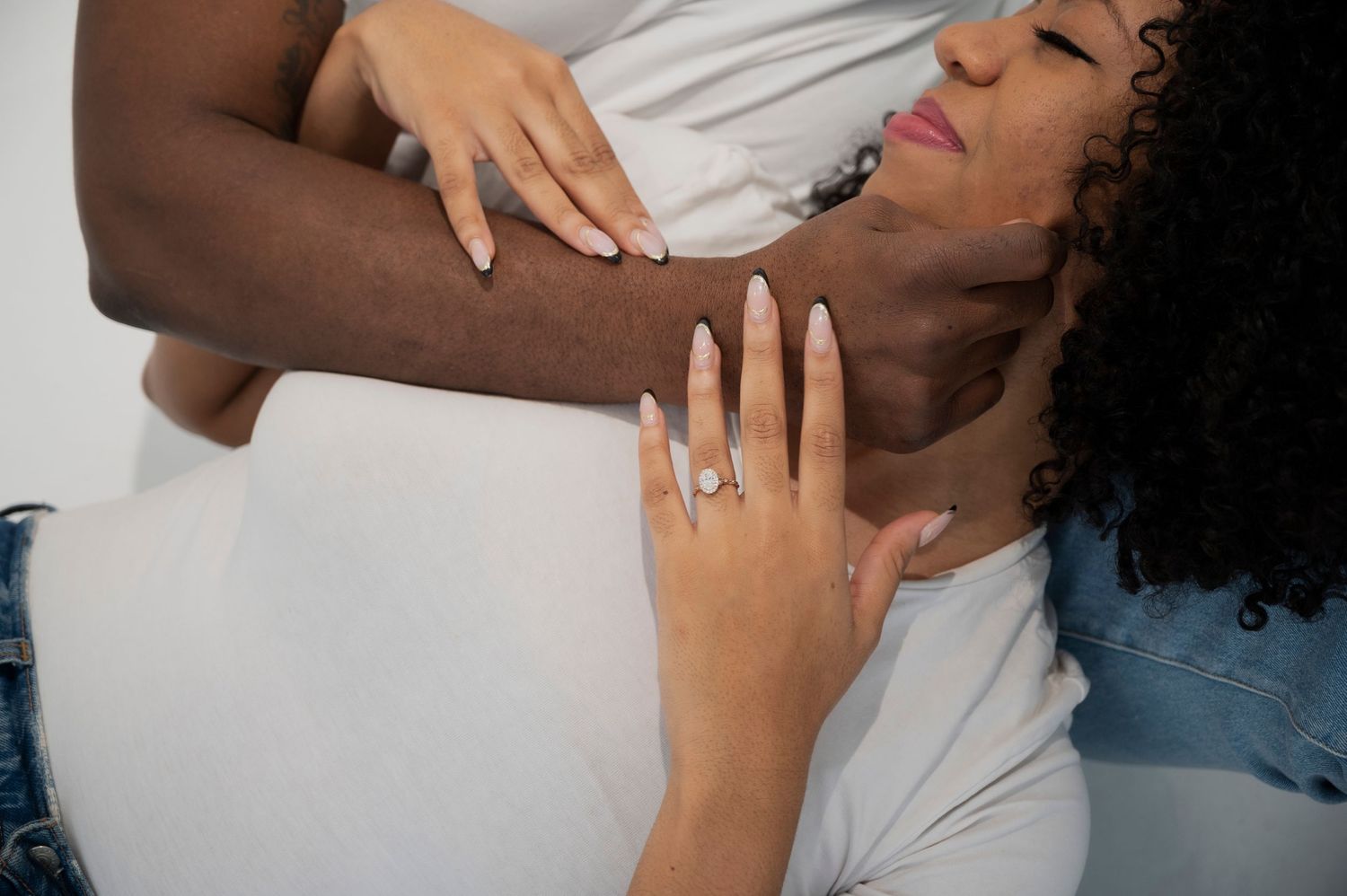 Close-up shots showing hands gently touching and embracing.