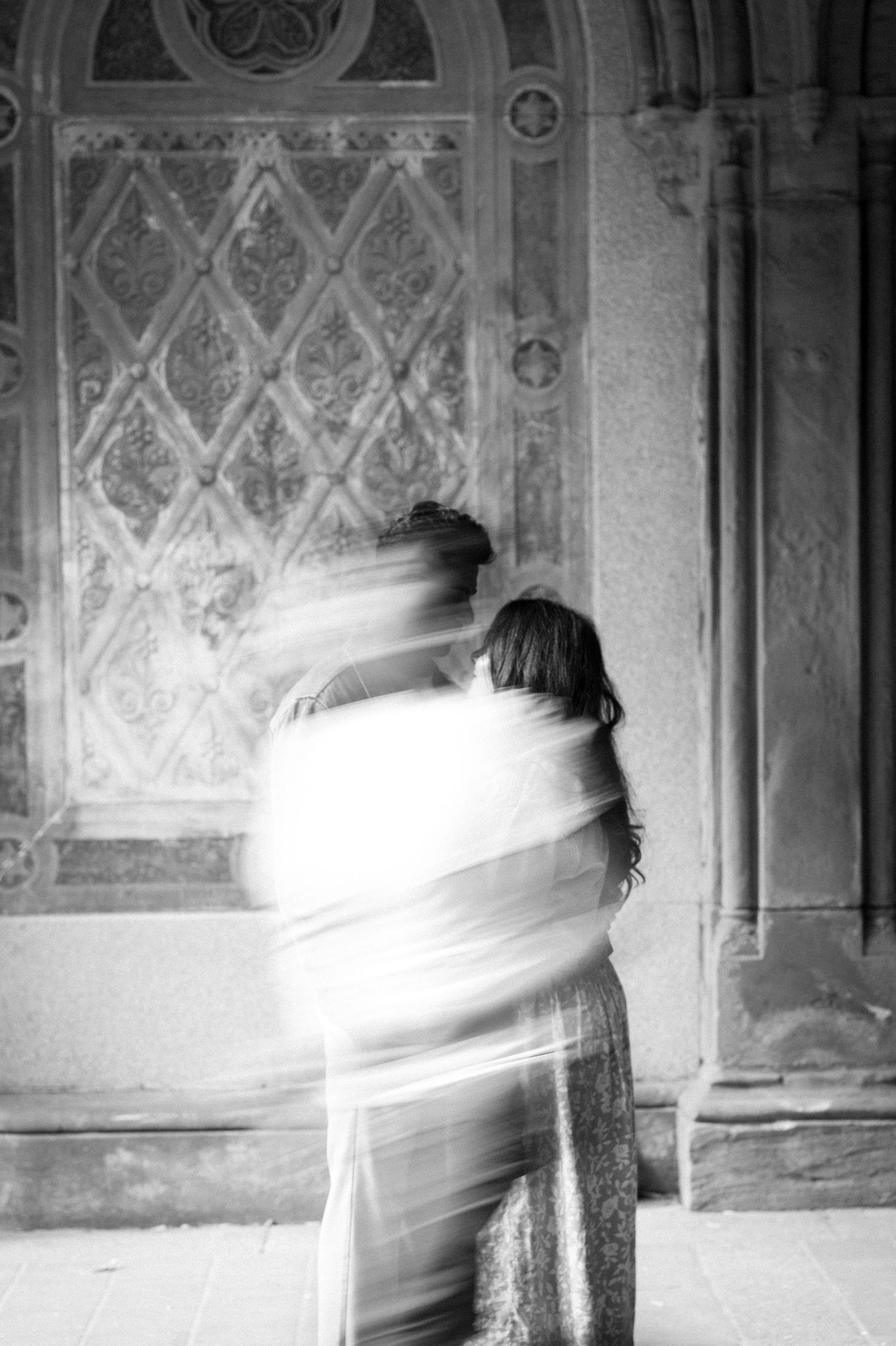 Abstract motion blur photograph in an ornate architectural interior.