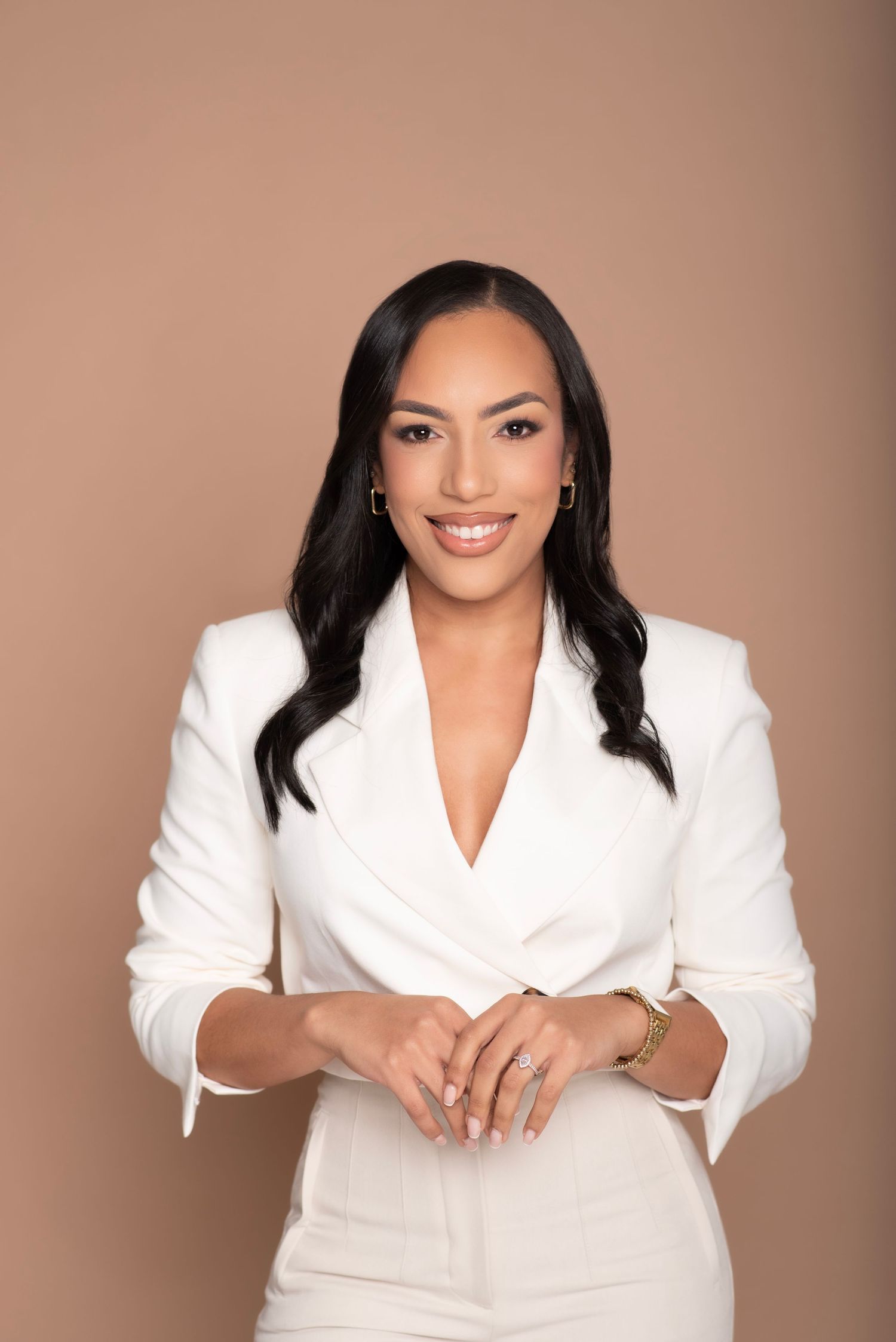 Professional headshots of woman in white blazer against neutral background showing confident poses.