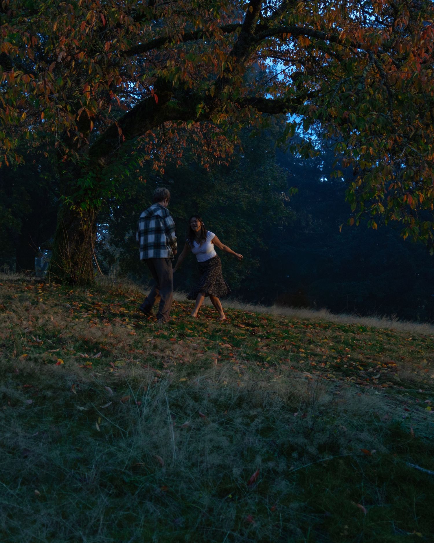 BC Couples session, storytelling, documentary session, man and woman run around together underneath a tree