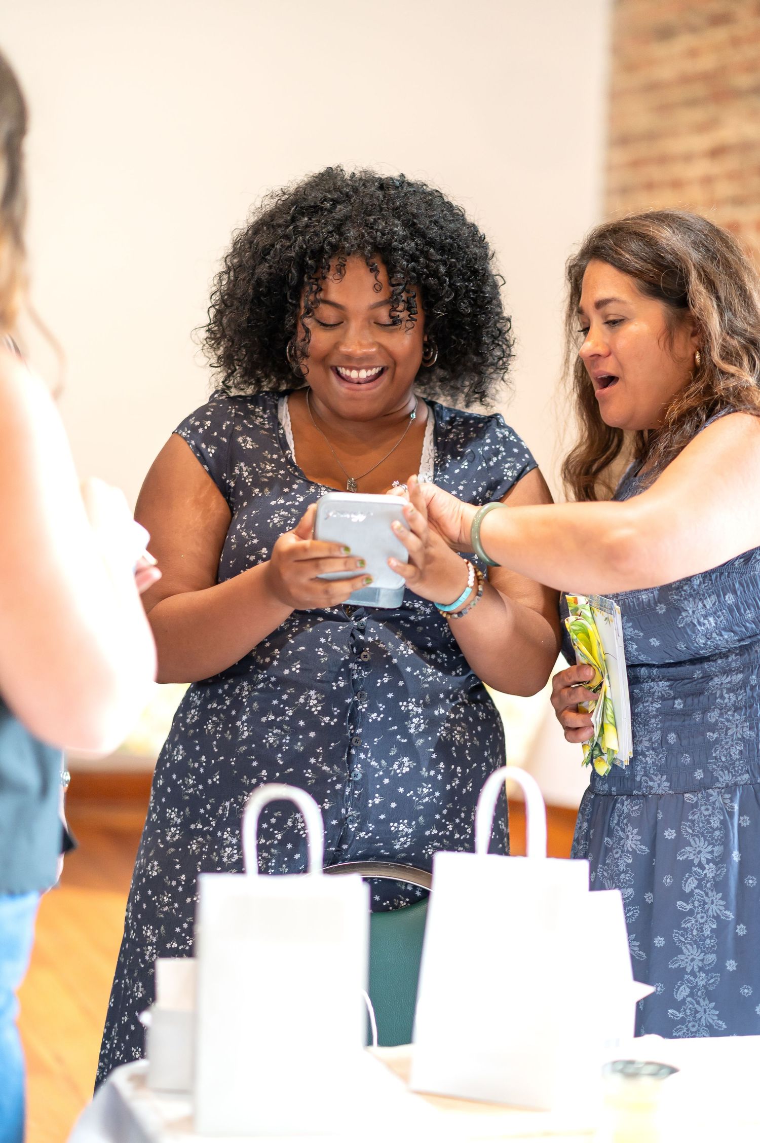 A sequence of photos showing someone drinking from a cup while wearing a blue floral print dress.