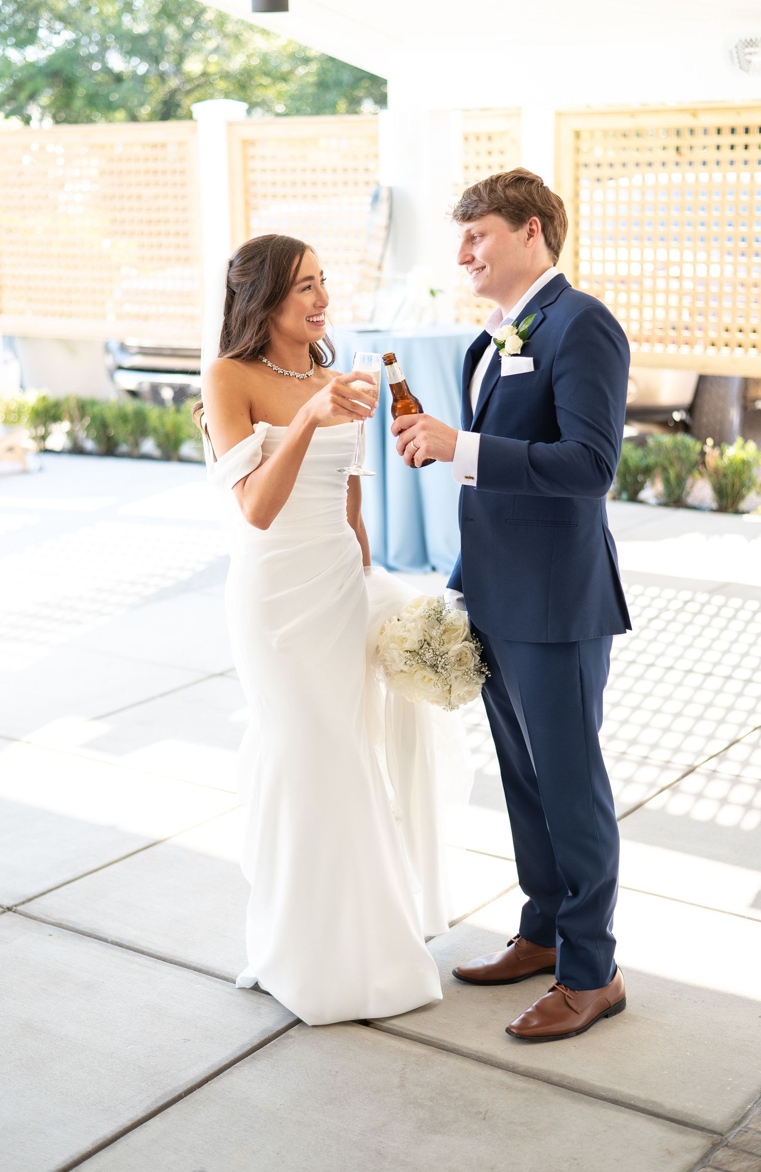 Playful dancing sequence between couple in wedding attire.