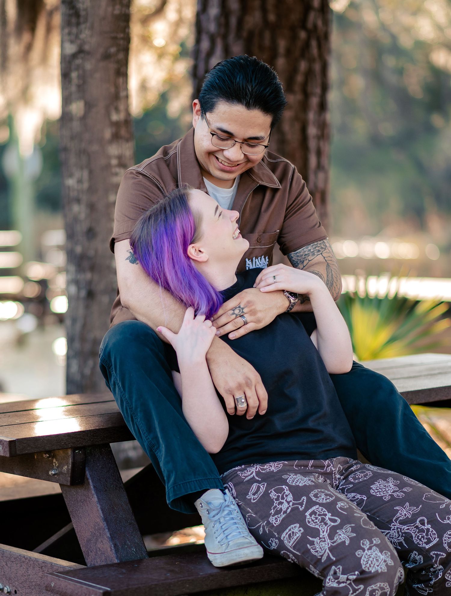 Candid laughter during a Summerville couples session at Ashley River Blue Trail. A documentary Keepsake story-frame.